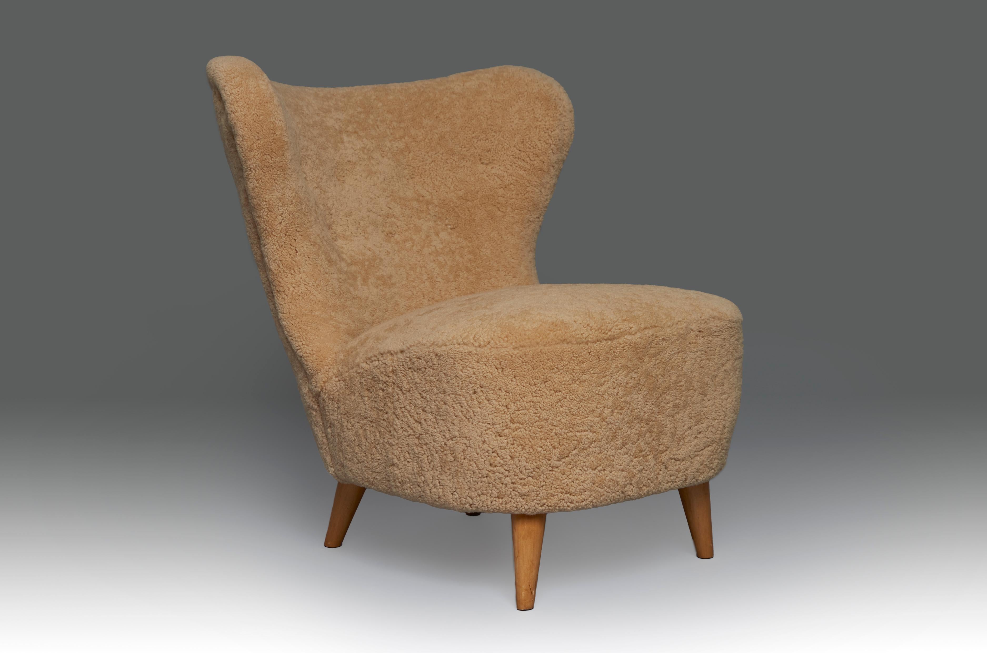 Easy chair in birch and natural sheepkin by anonymous designer, clean and simple yet modern design. Magnificent restored condition and newly ulpholstered.
 