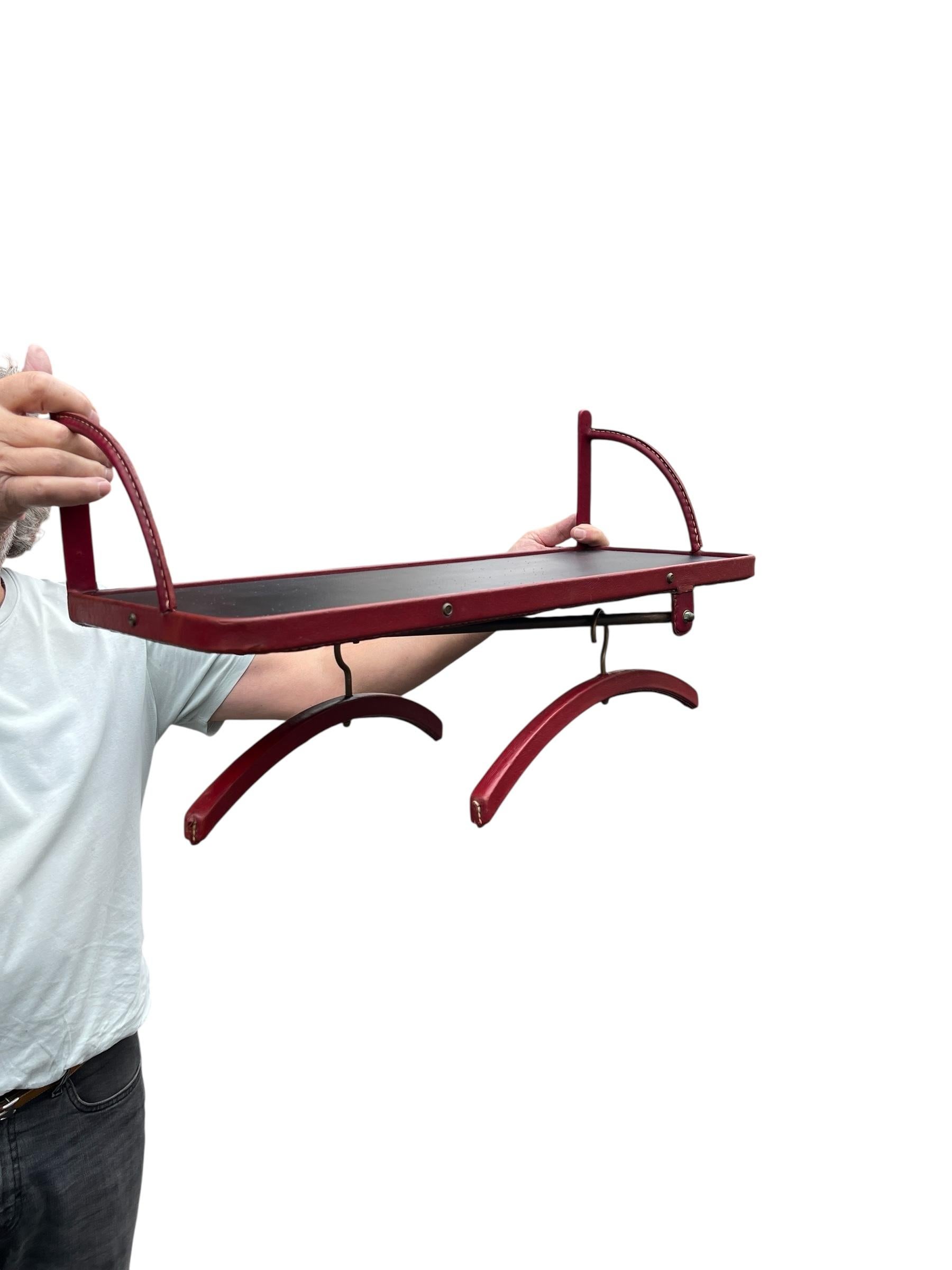 Rare 1950's Stitched leather shelve with coat hangers
Great vintage condition
Possibility of a second one to make a pair 