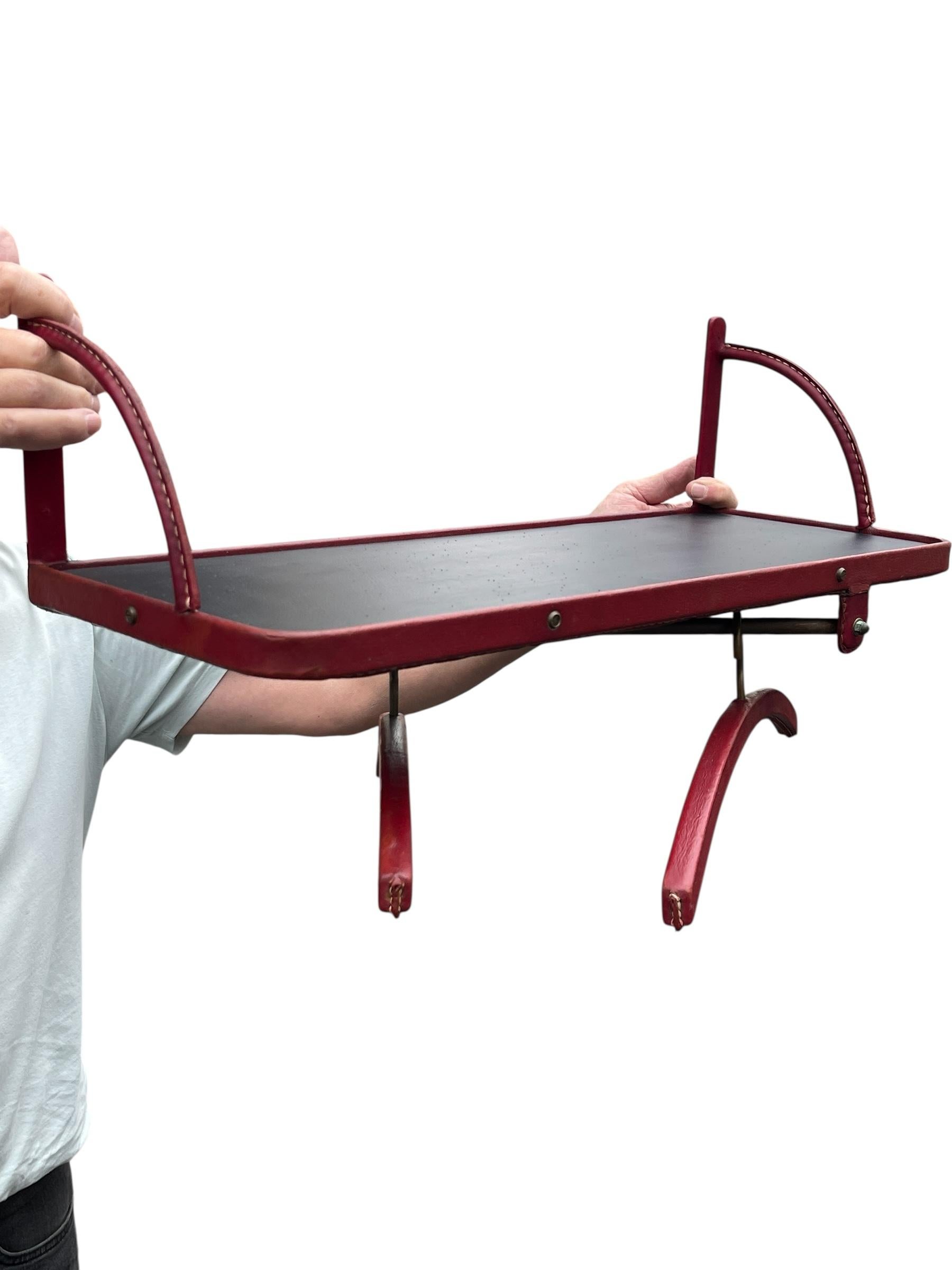 French 1950's Shelve with two coat hangers by Jacques Adnet For Sale