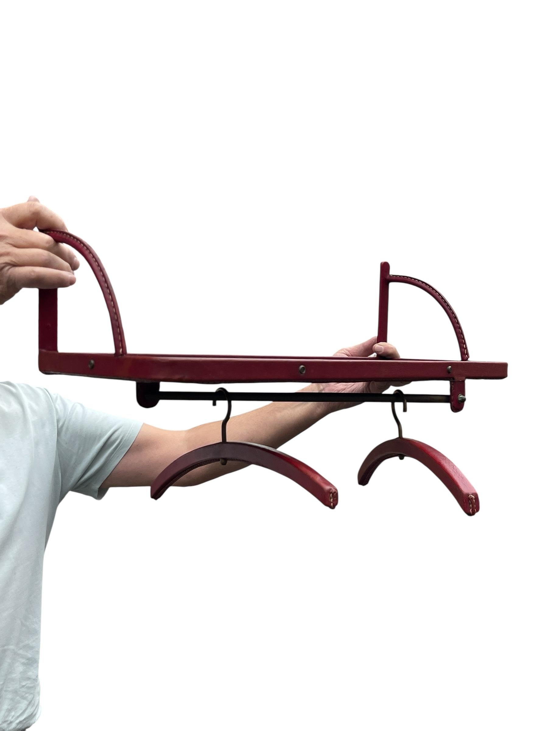 1950's Shelve with two coat hangers by Jacques Adnet In Good Condition For Sale In Bois-Colombes, FR