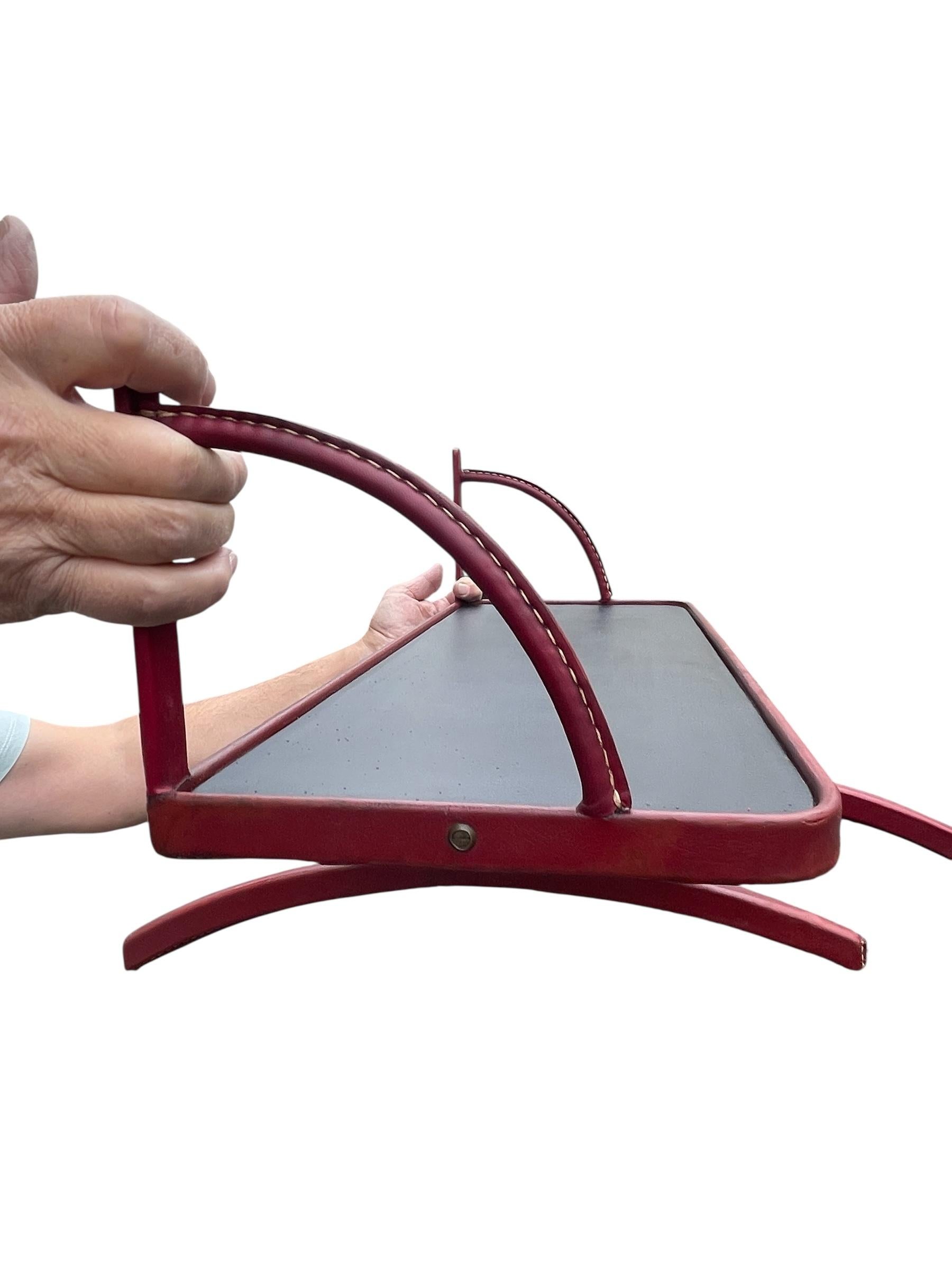 Leather 1950's Shelve with two coat hangers by Jacques Adnet For Sale