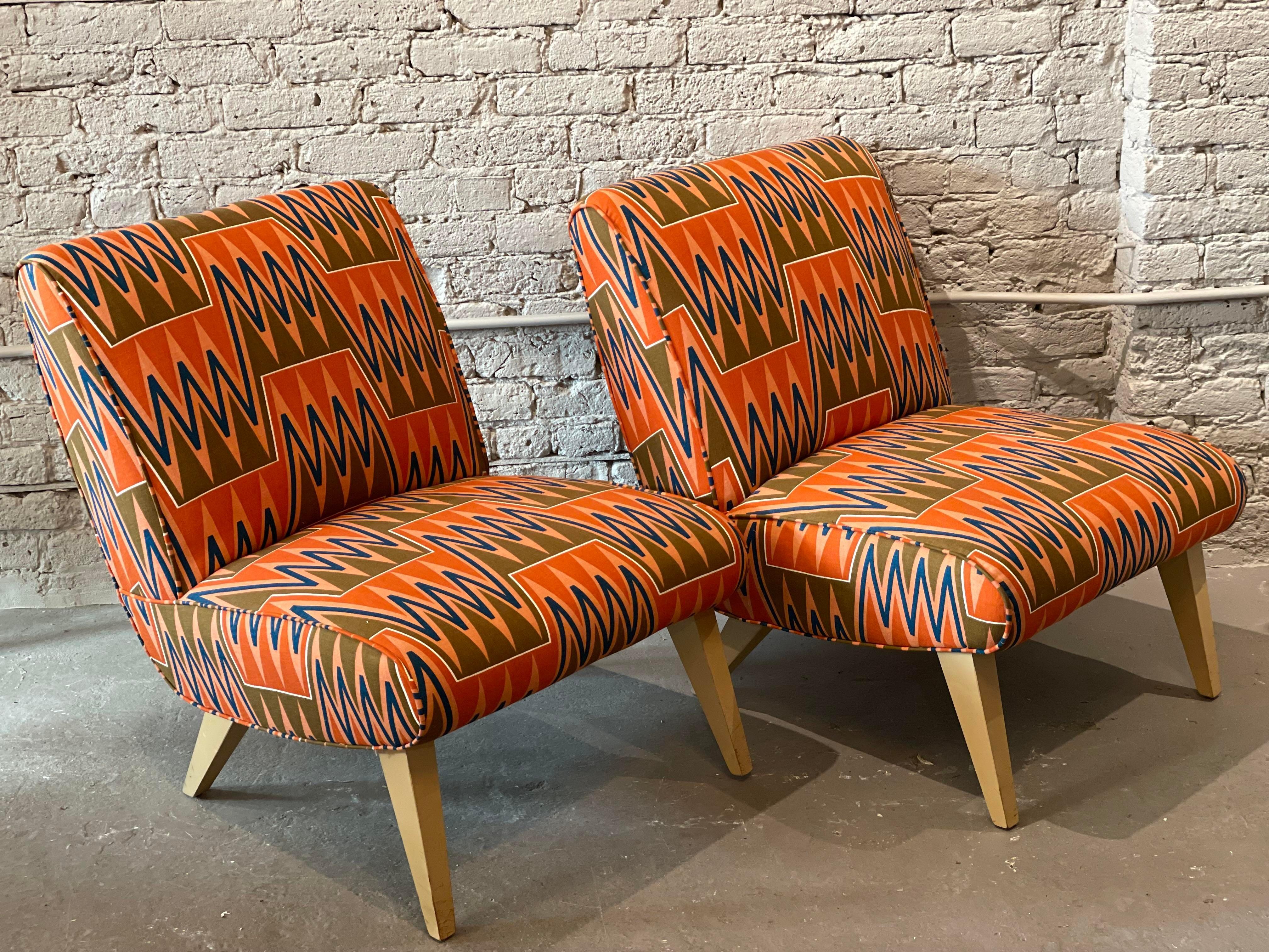 What cool lines! The simplicity and comfort allow for these chairs to be used in any room. They were recently reupholstered in this mid century style fabric.