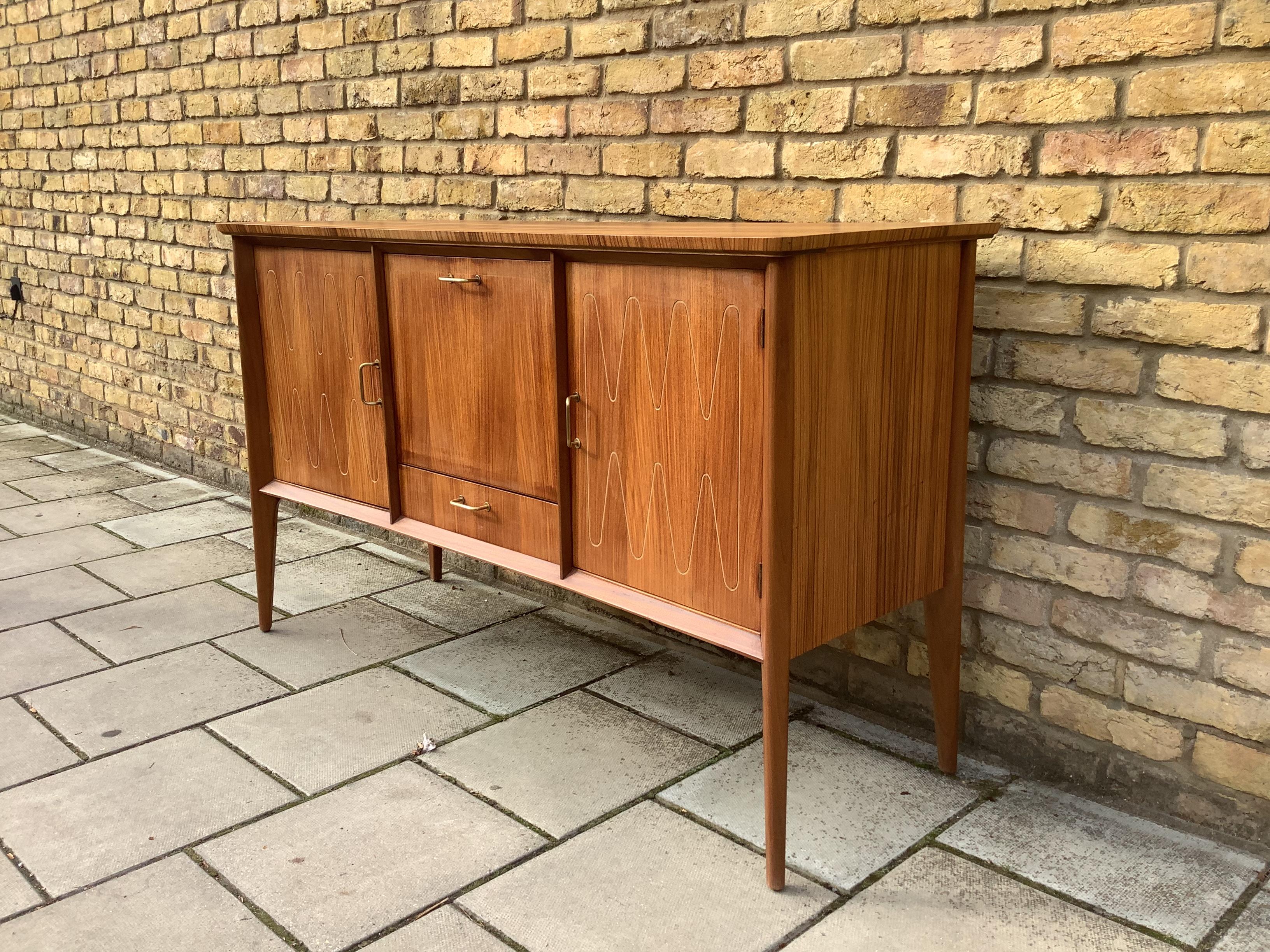 A stunning sideboard/ drink cabinet with brass handles and double helix design for Gordon Russell by David Booth.

Cc1950’s

 

 

Sir Gordon Russell shaped the history of 20th-century British design, bridging the gap from the arts and