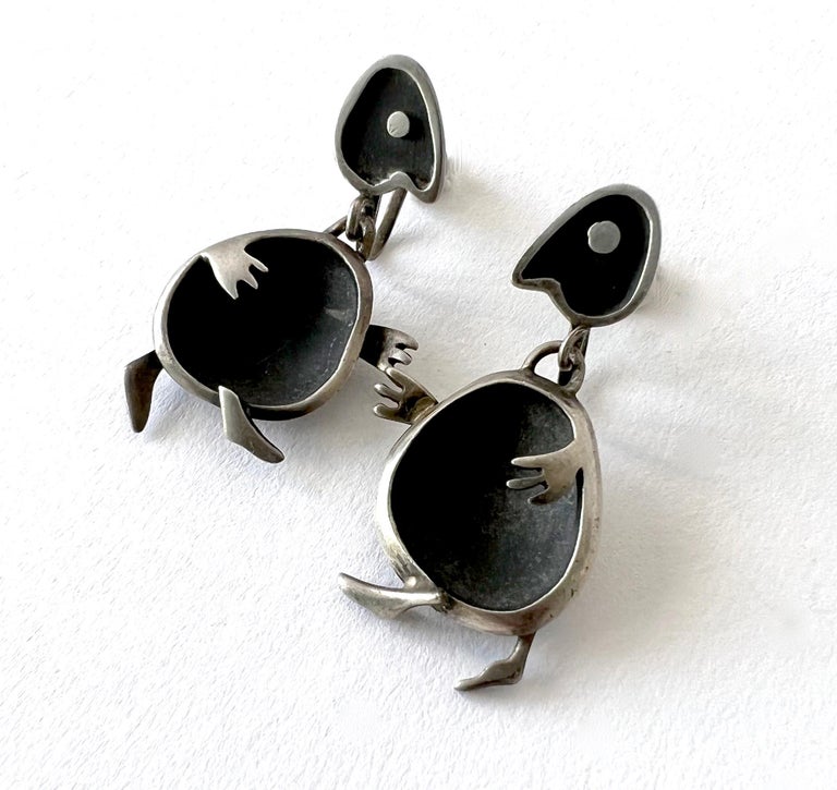 Silver silver screw back dangle earrings created by Sigi Pineda of Taxco, Mexico.  Playful earrings measure 1.75