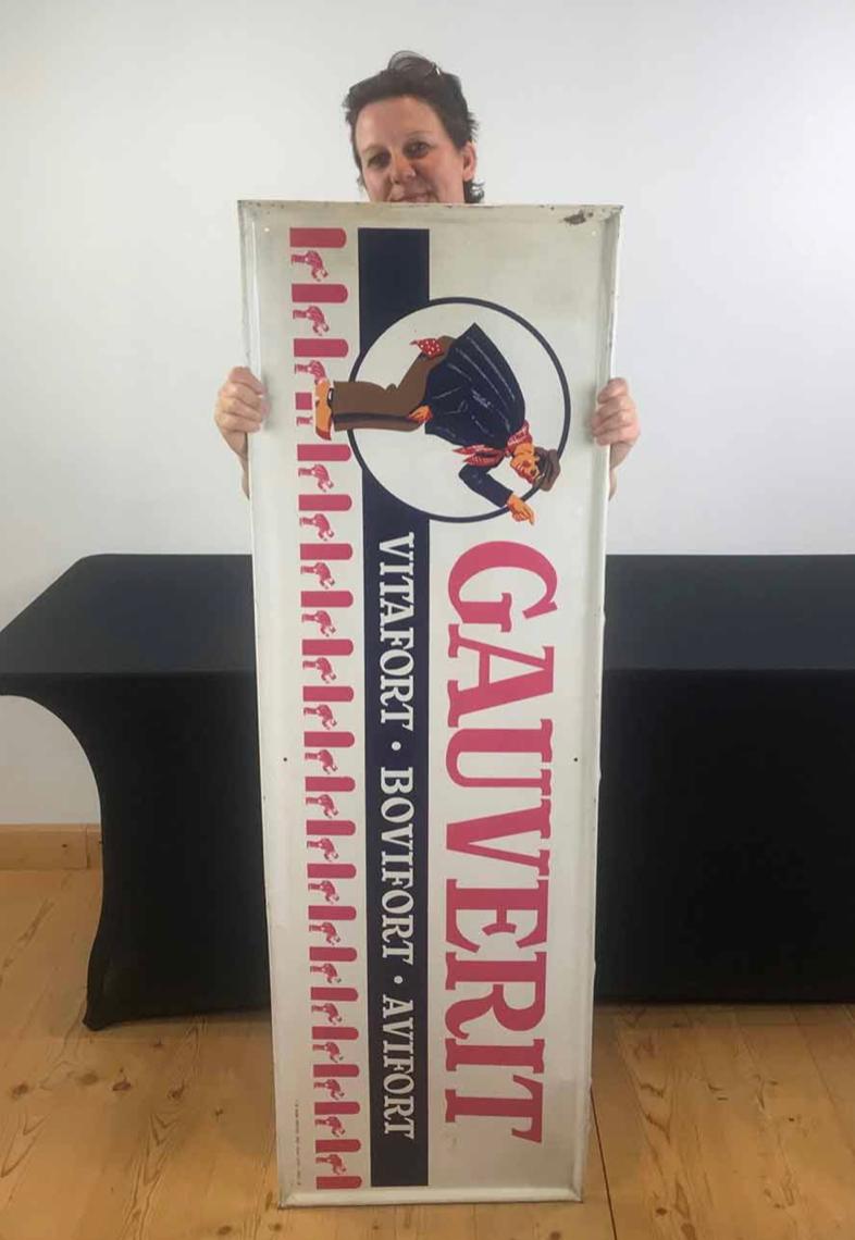 1950s Advertising sign with lots of farmers for fodder. 
A large metal sign dated 1957 - Made by Sobi Brussels. 
Gauverit cattle fodder sign. 
With a design of a farmer wearing typical clothes: red and white scarf and wooden clogs. Under you see