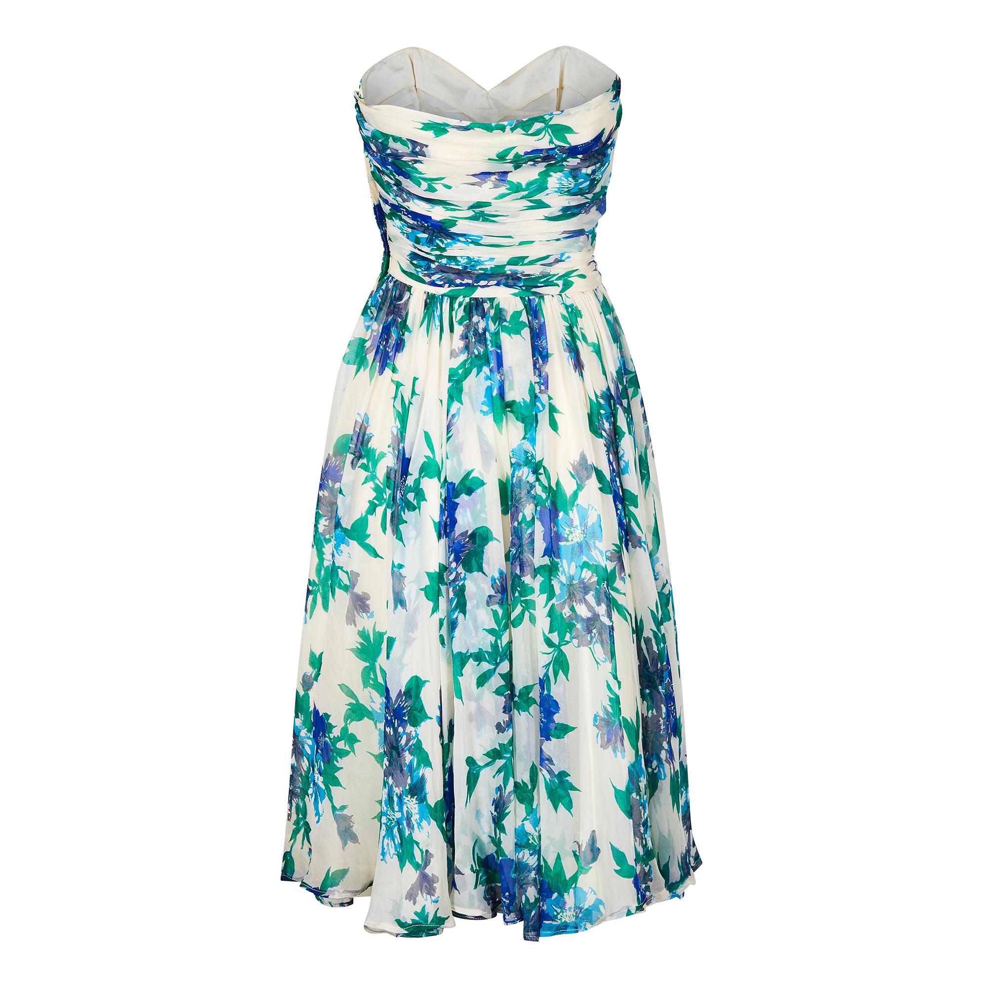 1950s floral silk chiffon strapless dress with matching scarf. This delightful silk chiffon dress has a wonderful colour combination of cobalt blue, turquoise and emerald green against an an ivory background.  The bodice has the archetypal ruching