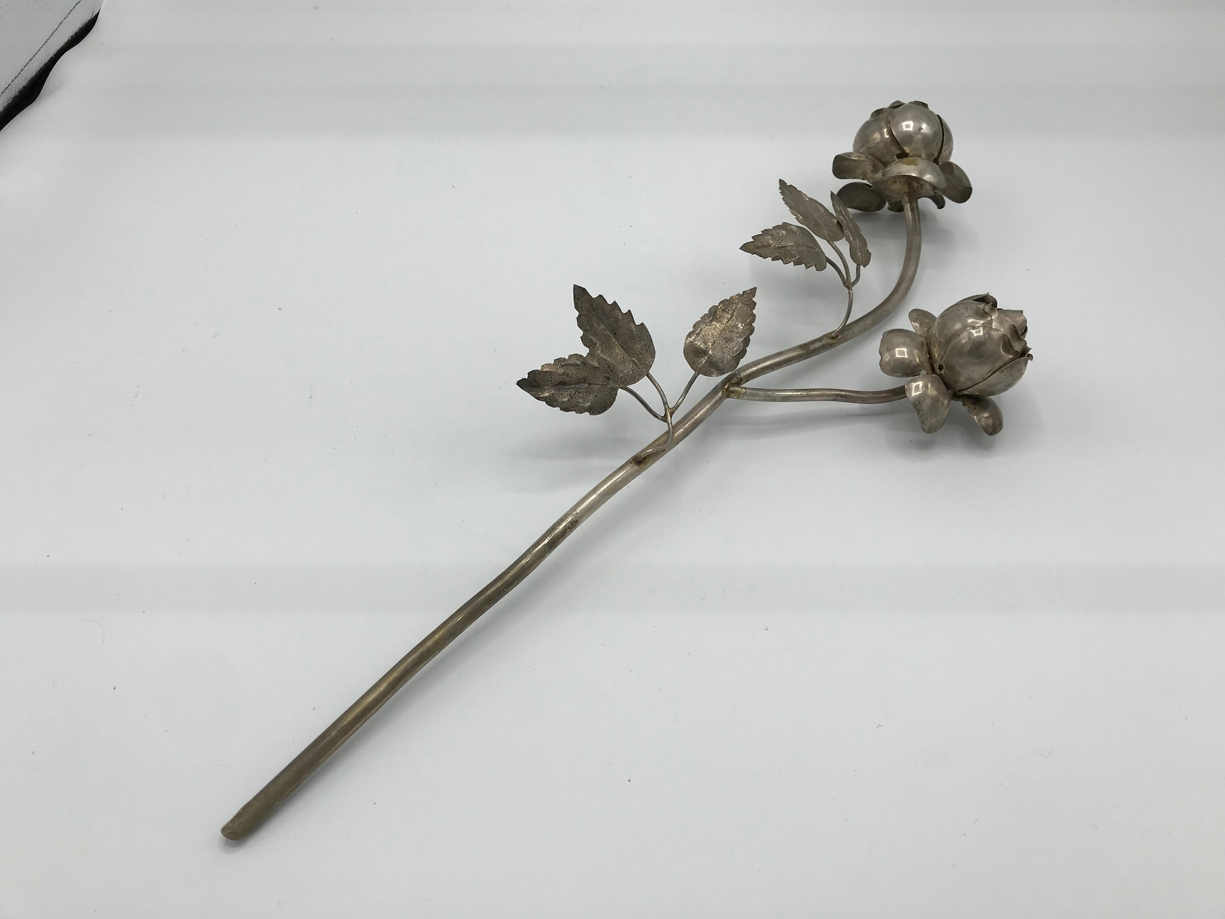 Listed is a gorgeous, delicately handcrafted, 1950s silver plate rose stem sculpture. The piece has stunning attention to detail. Can stand upright in a vase! All-over patina, can easily be polished by buyer.