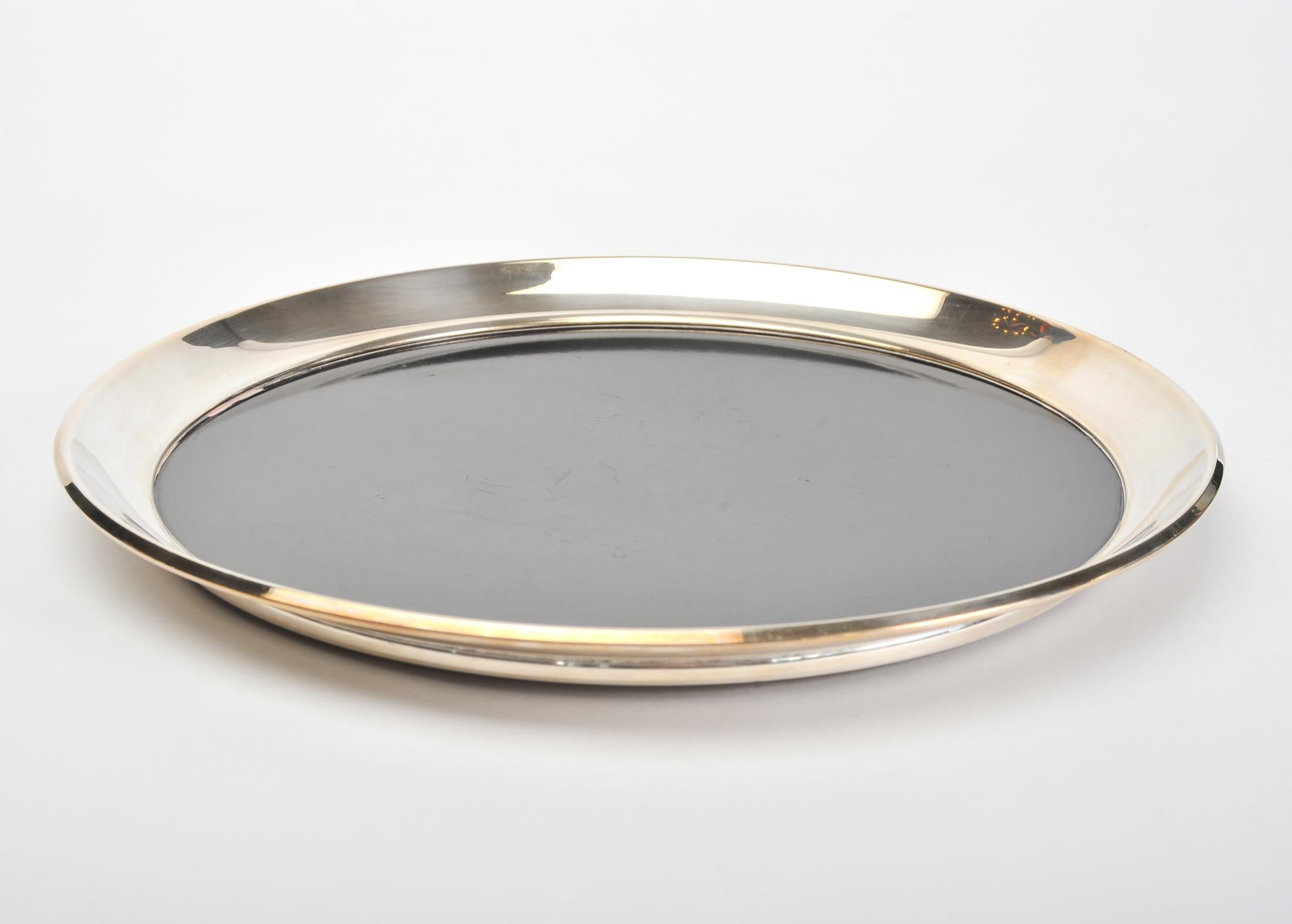 North American 1950s silver rimmed American circular tray