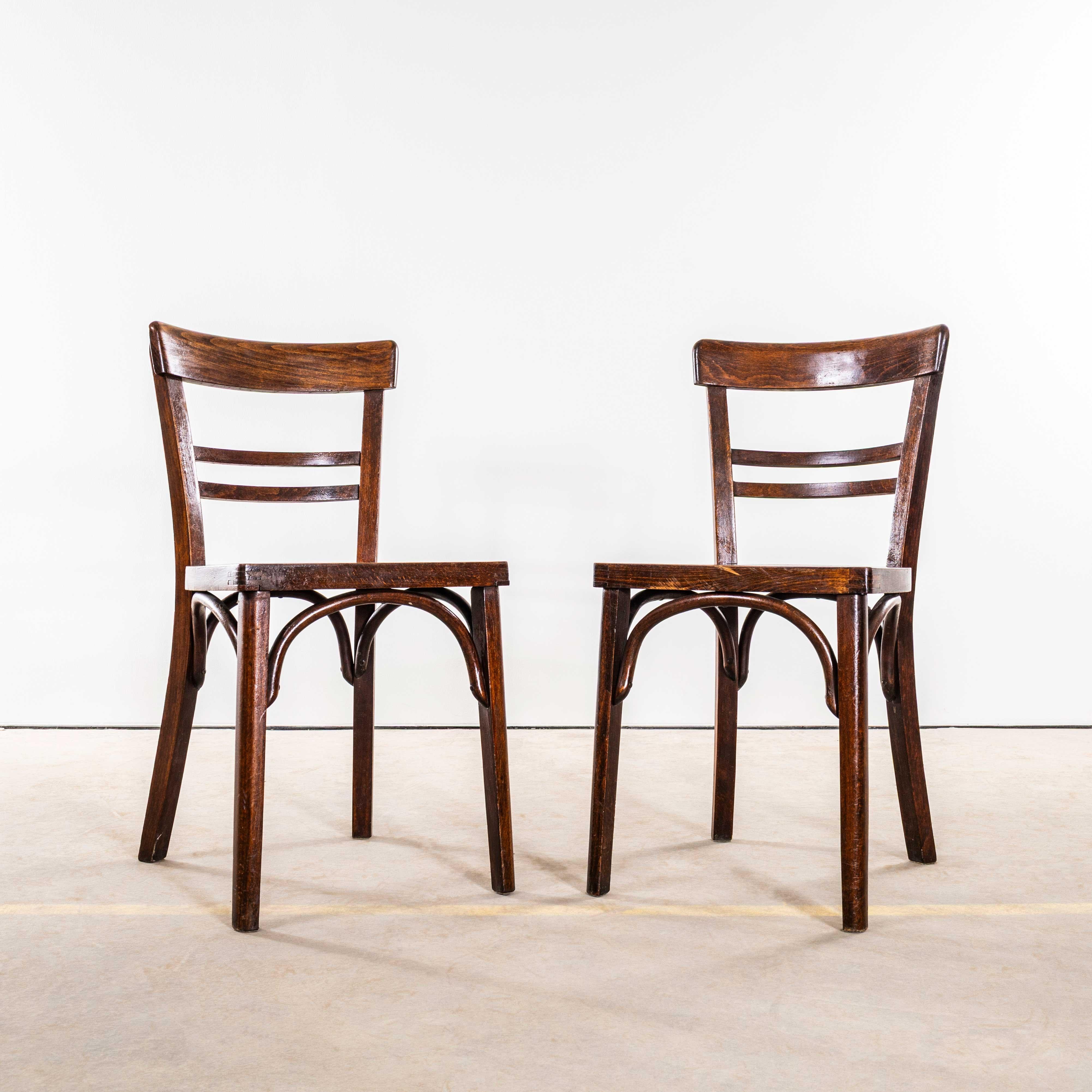 1950’s Dark Oak Double Ladder Back Bentwood Dining Chairs – Pair. 
Good quality classic bentwood chairs with a deep dark oak colour and classic ladder back bistro design. The chairs were made in Eastern Europe using solid steam bent beech, they are