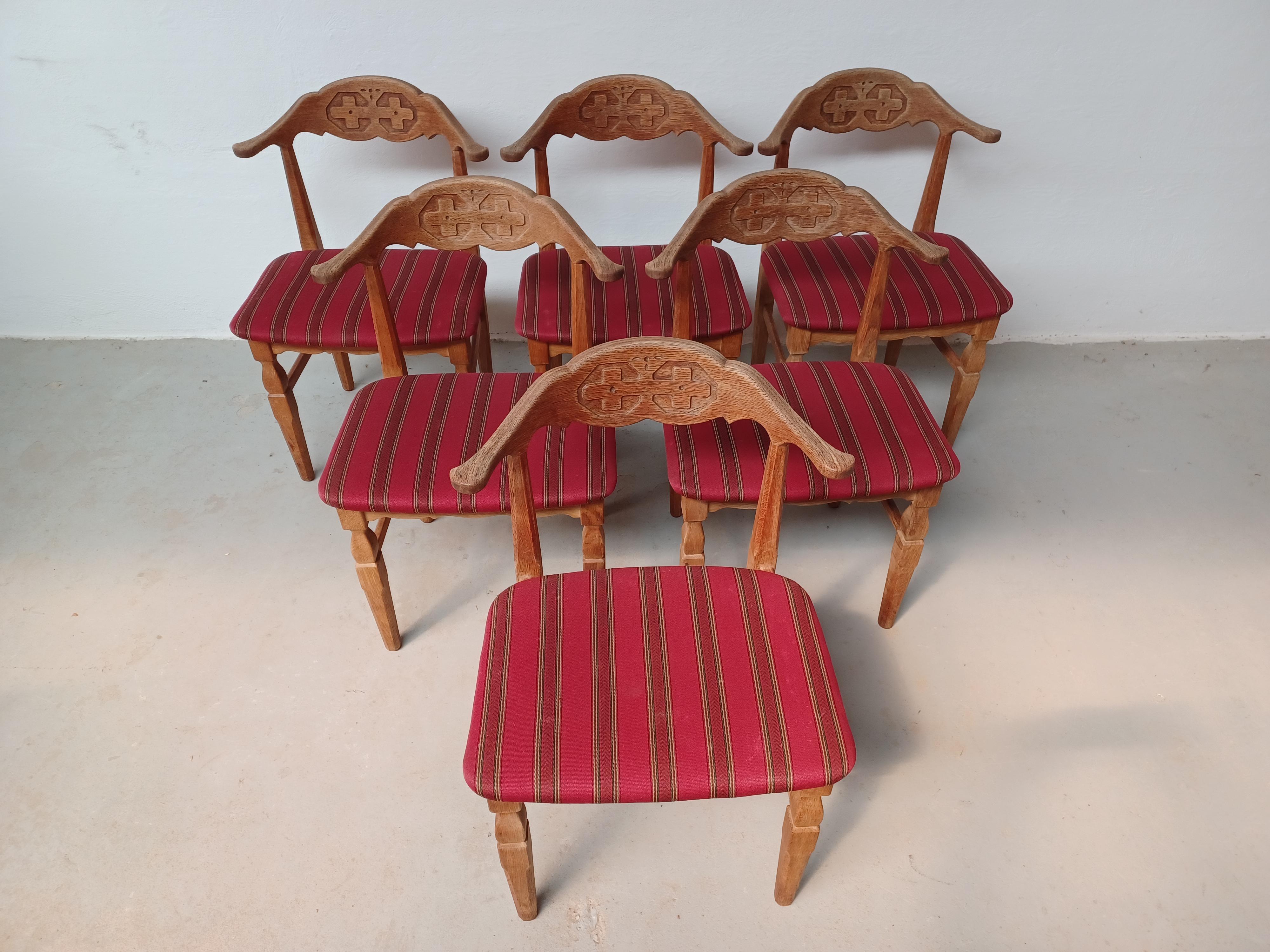 Set of 6 original Danish 1970s Brutalist chairs by Henning Kjærnulf for EG Møbler. 
The chairs are in solid patinated oak with original upholstery retained, in good vintage condition.

The chairs have been checked and cleaned by our  in house