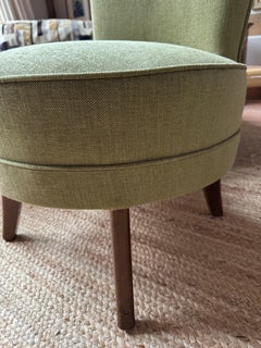 1950s slipper chair in cardamon green chennile with tapered wooden legs