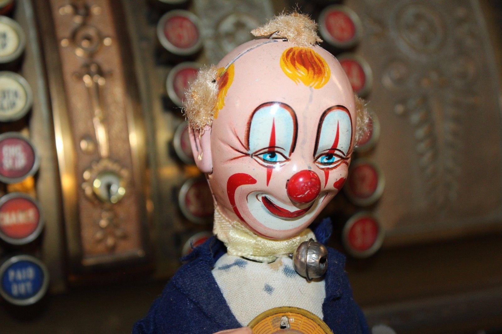 For your consideration we have a vintage Litho Tin Toy - Smiling Sam the carnival man clown wind up mechanical toy bobble head.