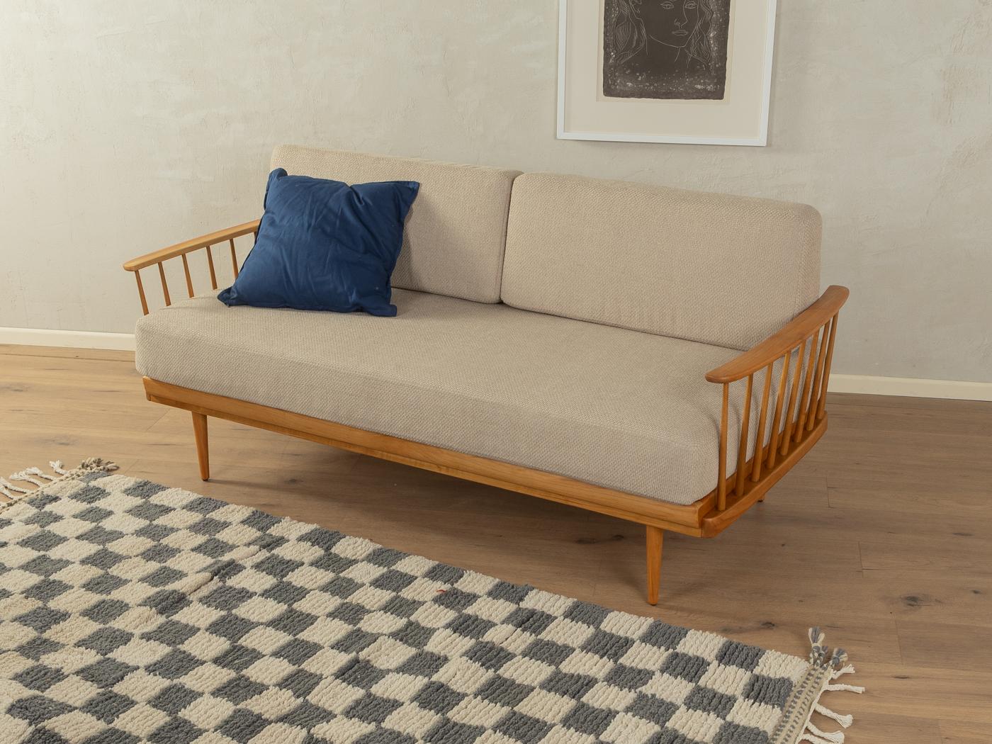 Wonderful sofa from the 1950s. Solid cherry frame with extendable head rest and adjustable back rest. The original spring core has been reupholstered and covered with a high-quality fabric in beige.
Quality Features:

    very good workmanship
   