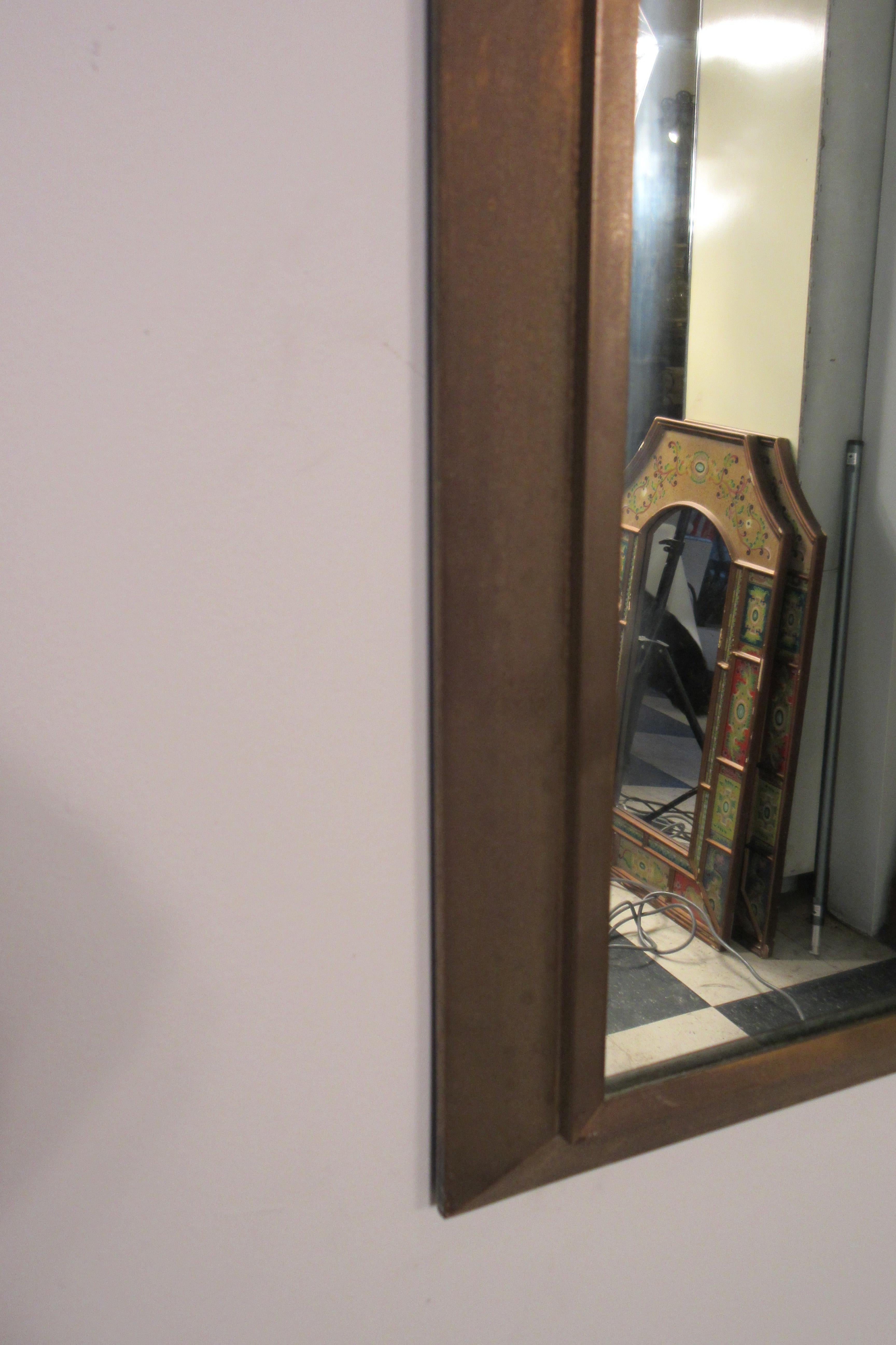 Very elegant 1950s solid brass mirror with beveled edge.