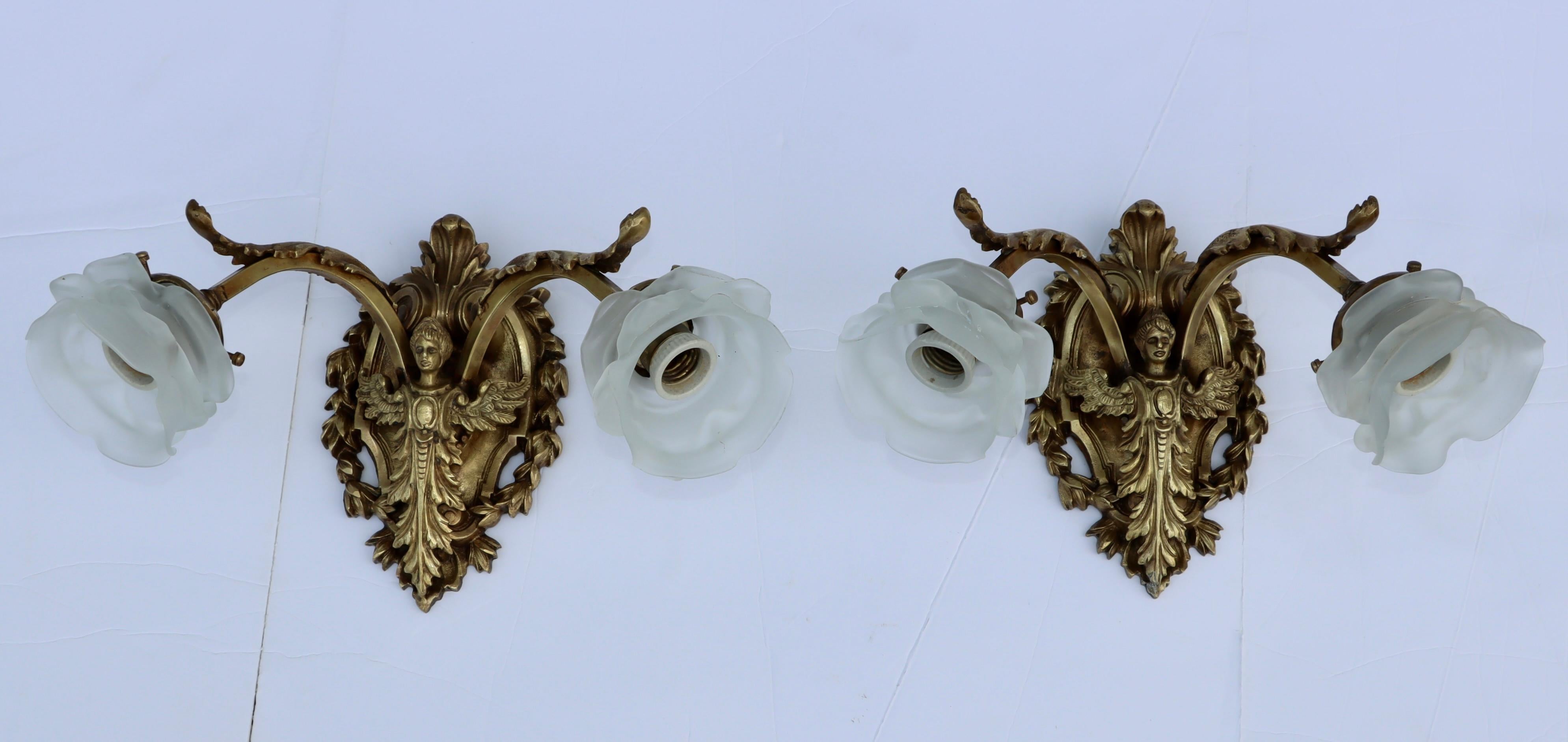 1950's solid brass French angel wall sconces with glass shades, in vintage original condition with some wear and patina due to age and use, newly rewired and ready to use.