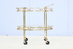 Carrello da bar ovale in ottone massiccio degli anni '50 di Maxwell Phillips