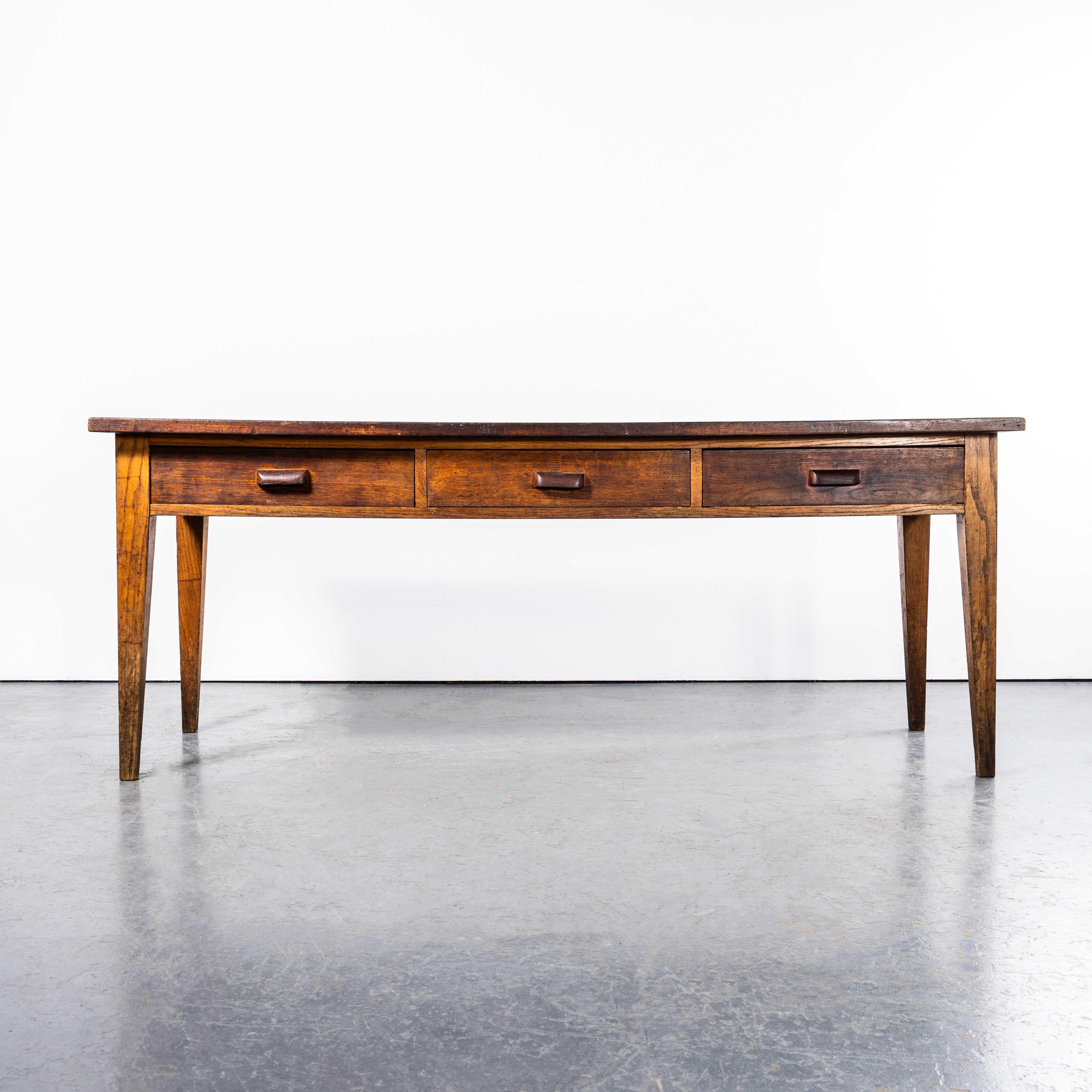 1950’s Solid Oak Three Drawer French Printers Workshop Table. 
Good three drawer rich character table from France. The stock label hints that it was from an institution or commercial use and we sourced it along with a number of other pieces from a