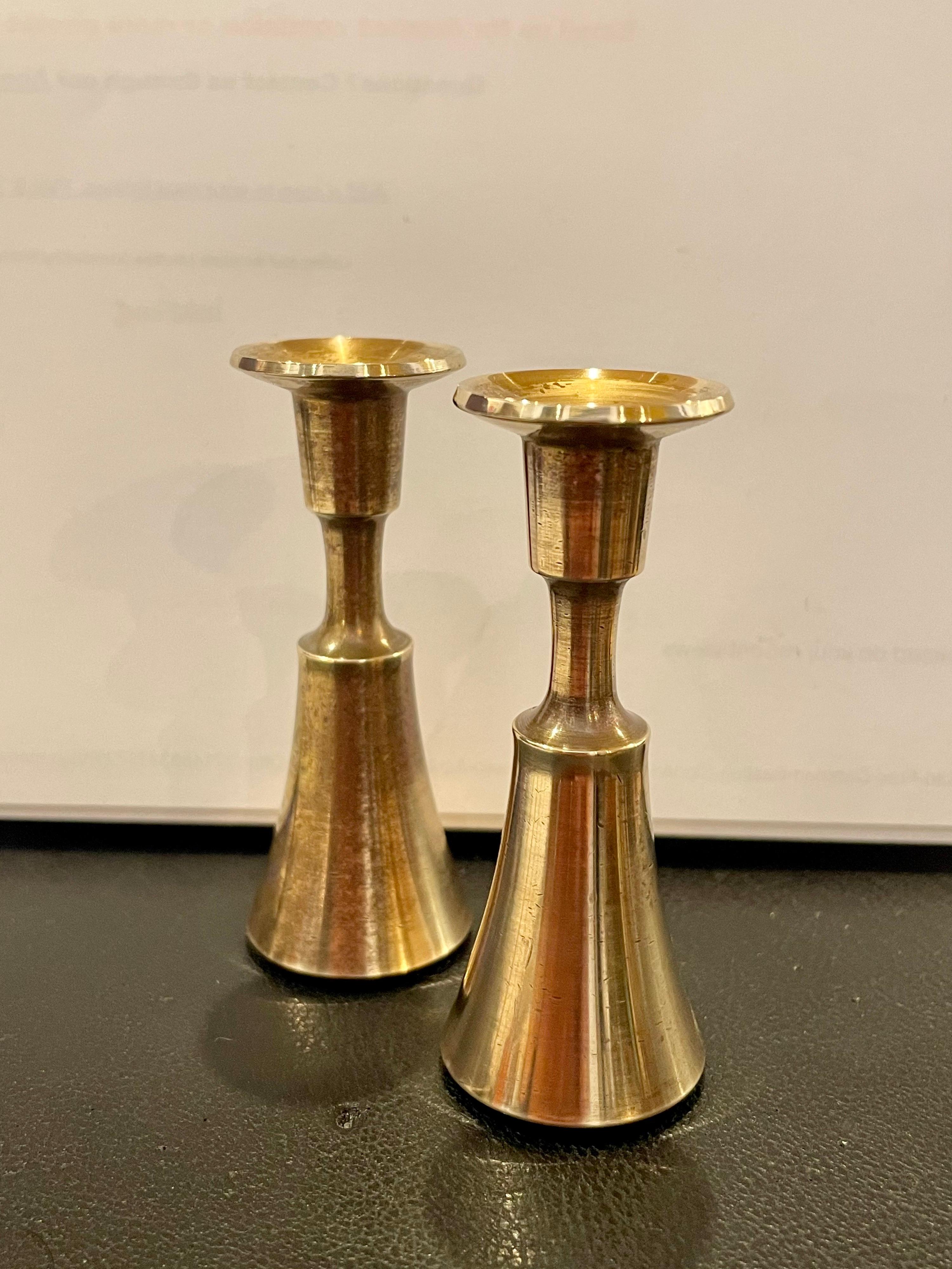 Nice set of small candle holders designed by Quistgaard for Dansk, early production, nice polished brass that fits long skinny tapper candles, great and simple design, nice and heavy stamped at the bottom nice light patina that can be polished, to