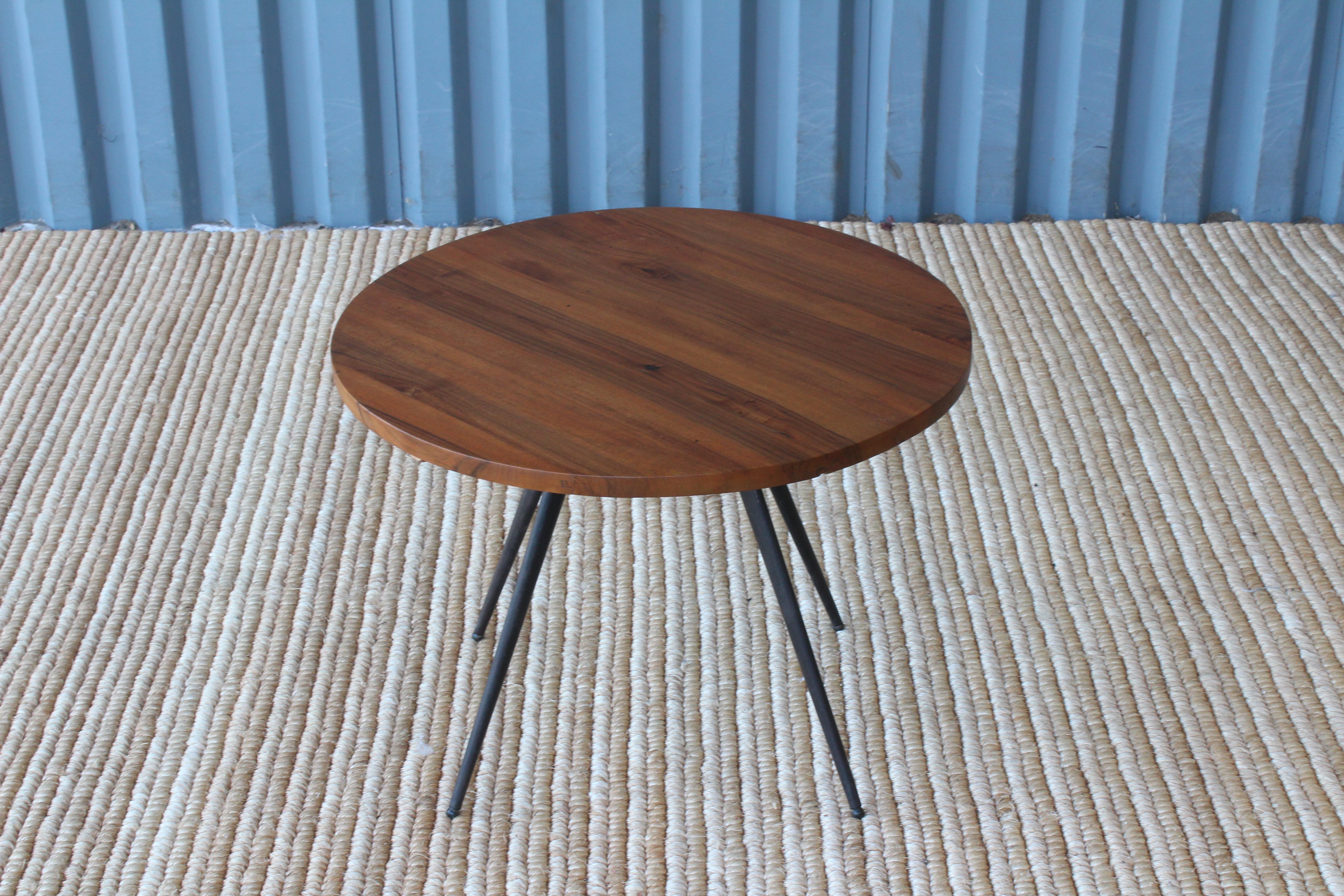 Side table with solid teak surface on a black metal base. Top has been refinished
  