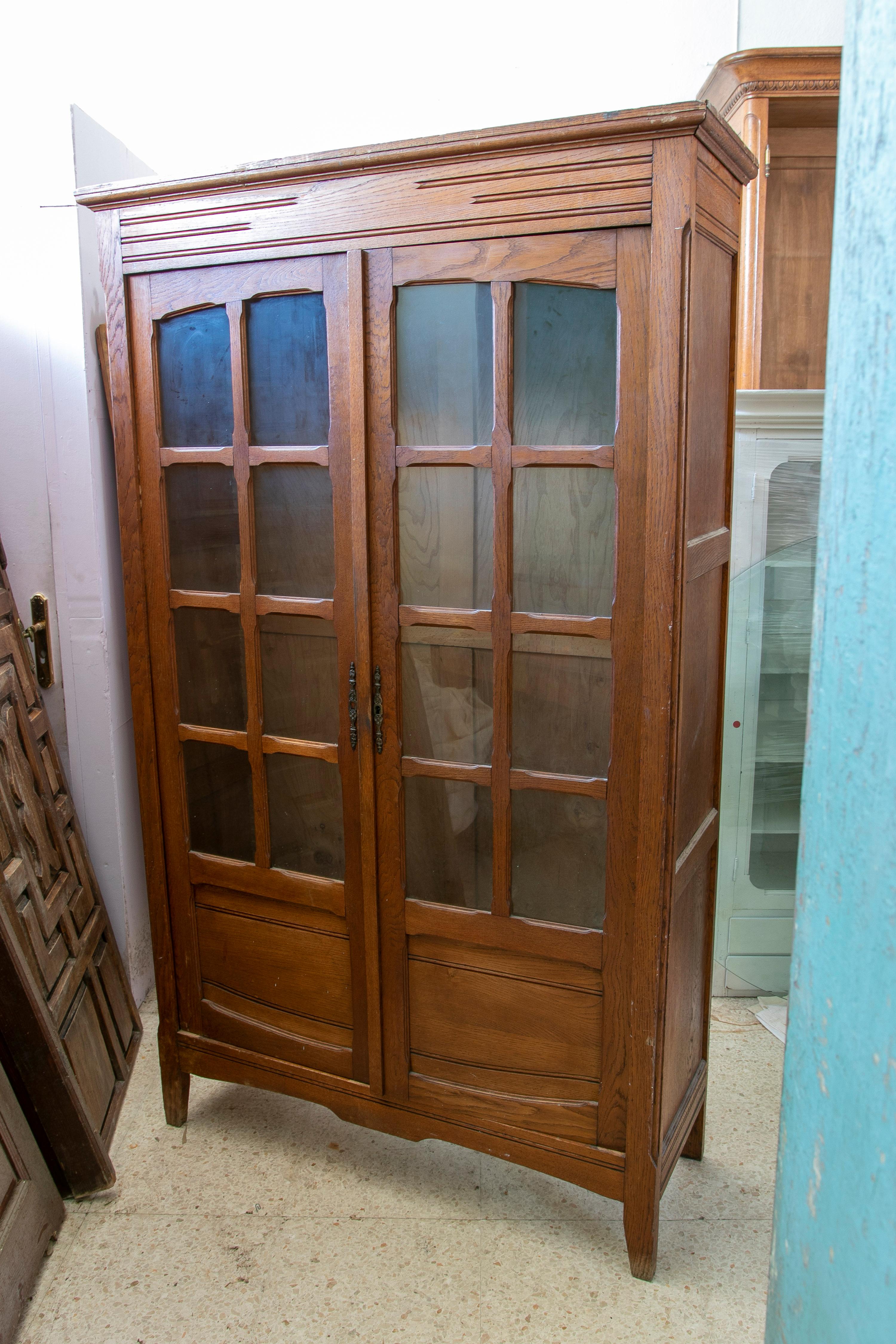 Vintage 1950s Spanish 2-door glass cabinet wooden wardrobe.

 