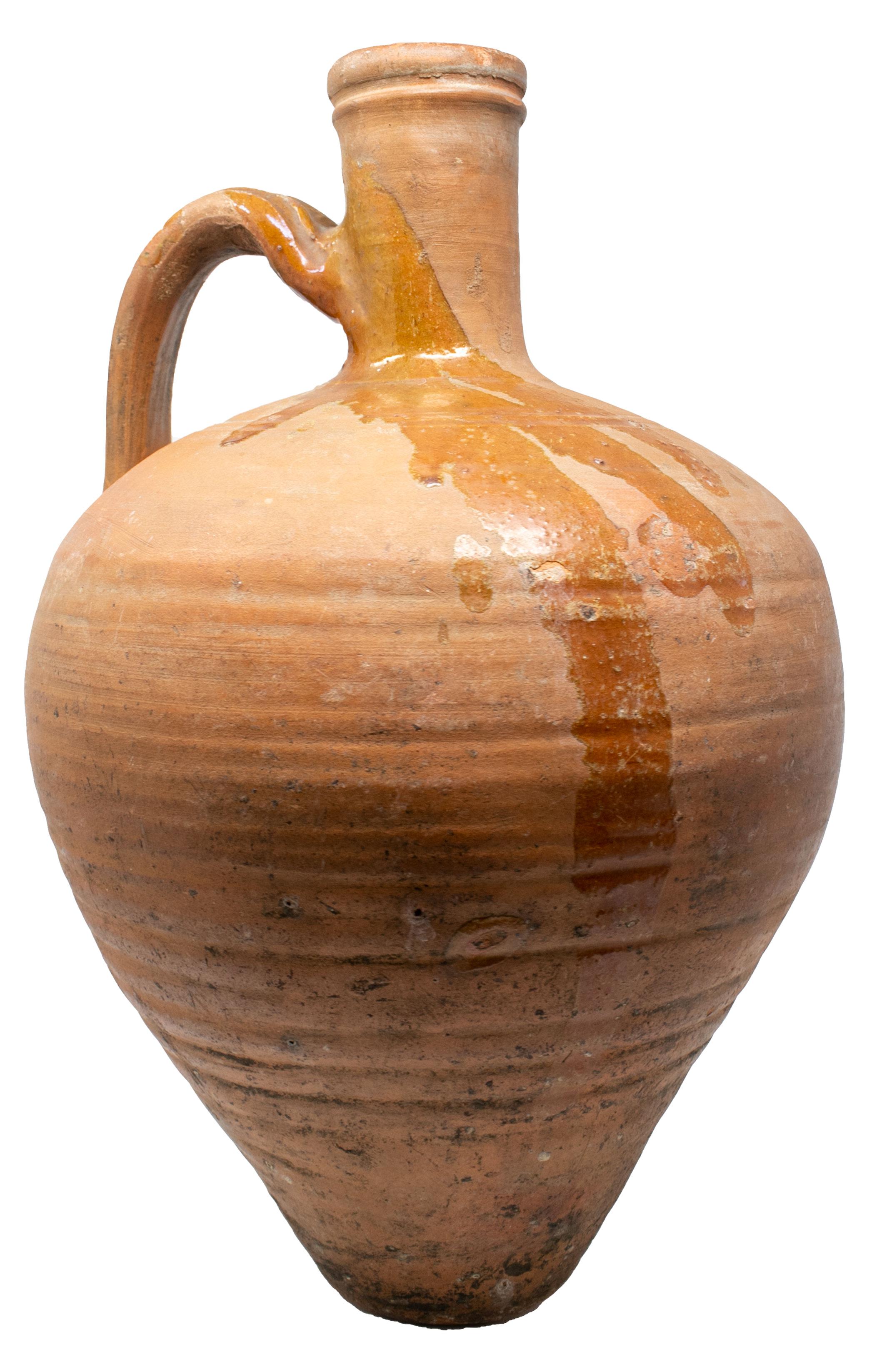 1950s Spanish Andalusian handmade terracotta vase splashed with brown glazing.