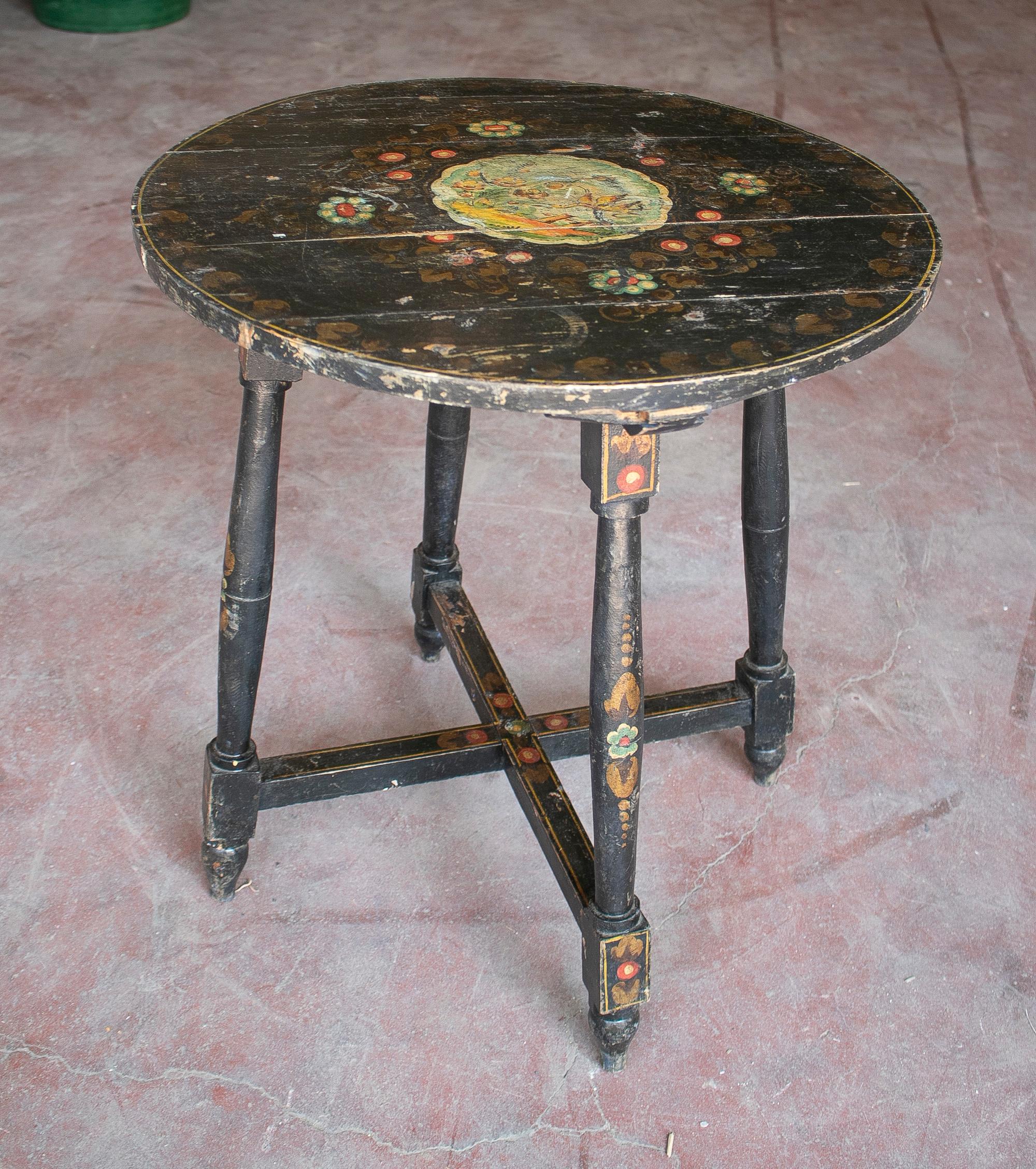 Rustic 1950s Spanish Andalusian hand painted black round table with plant motifs.