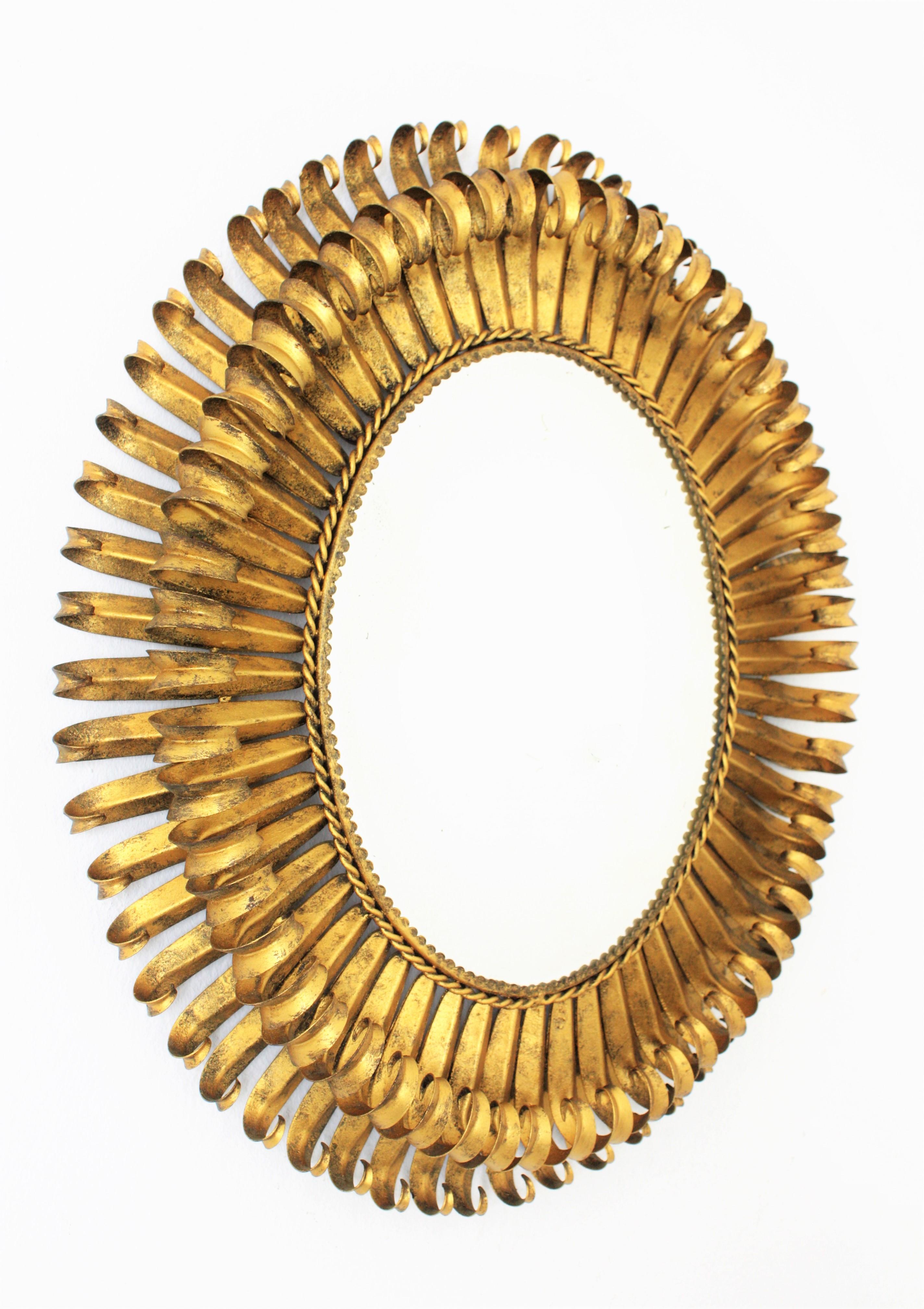Mid-Century Modern 1950s Spanish Brutalist Hammered Gilt Metal Eyelash Oval Sunburst Mirror 
