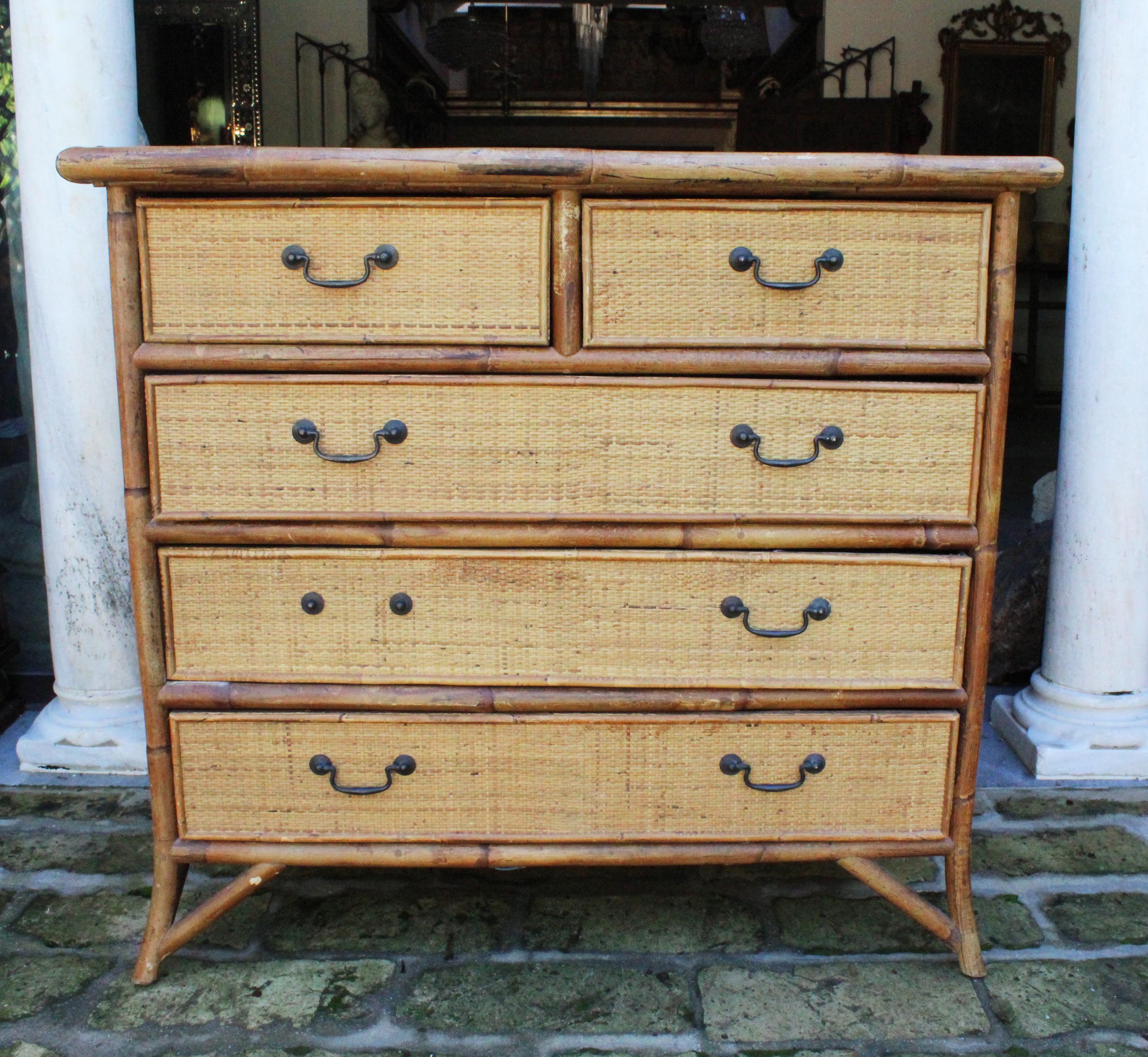 1950s Spanish cane and lazed wicker chest of drawers. One handle is missing.
