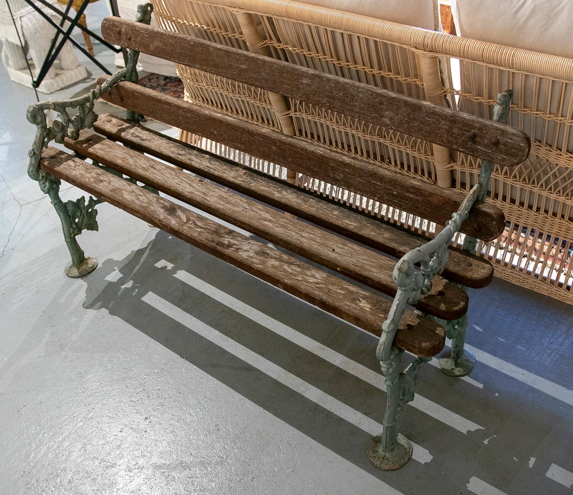 1950s Spanish Garden bench in green painted iron and wood.