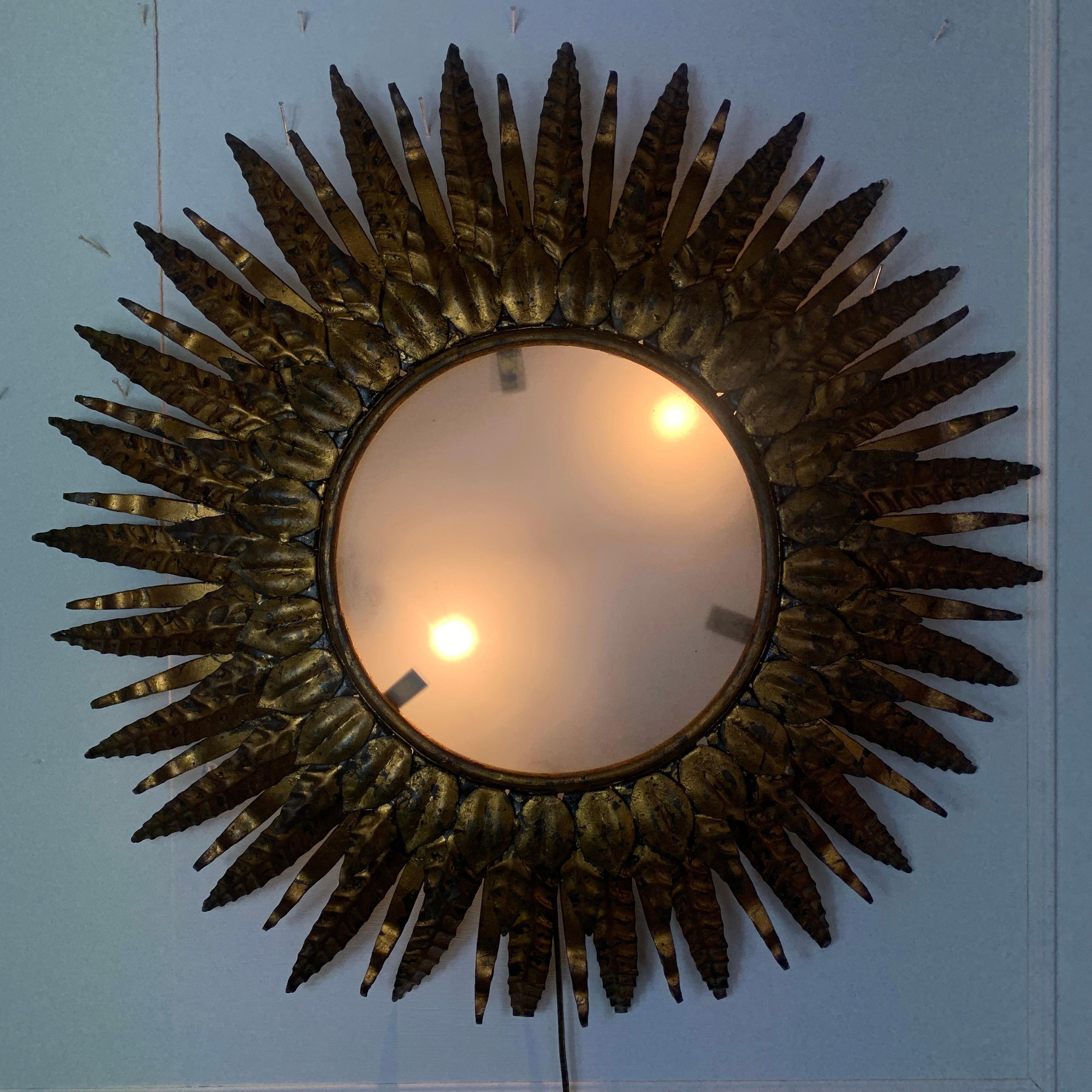 1950s Spanish gilt iron double sunburst ceiling light
An incredible gilt over metal Spanish double sunburst, featuring two lampholders sitting behind the opaque glass
This is a truly wonderful, and exceptionally well made example of a vintage