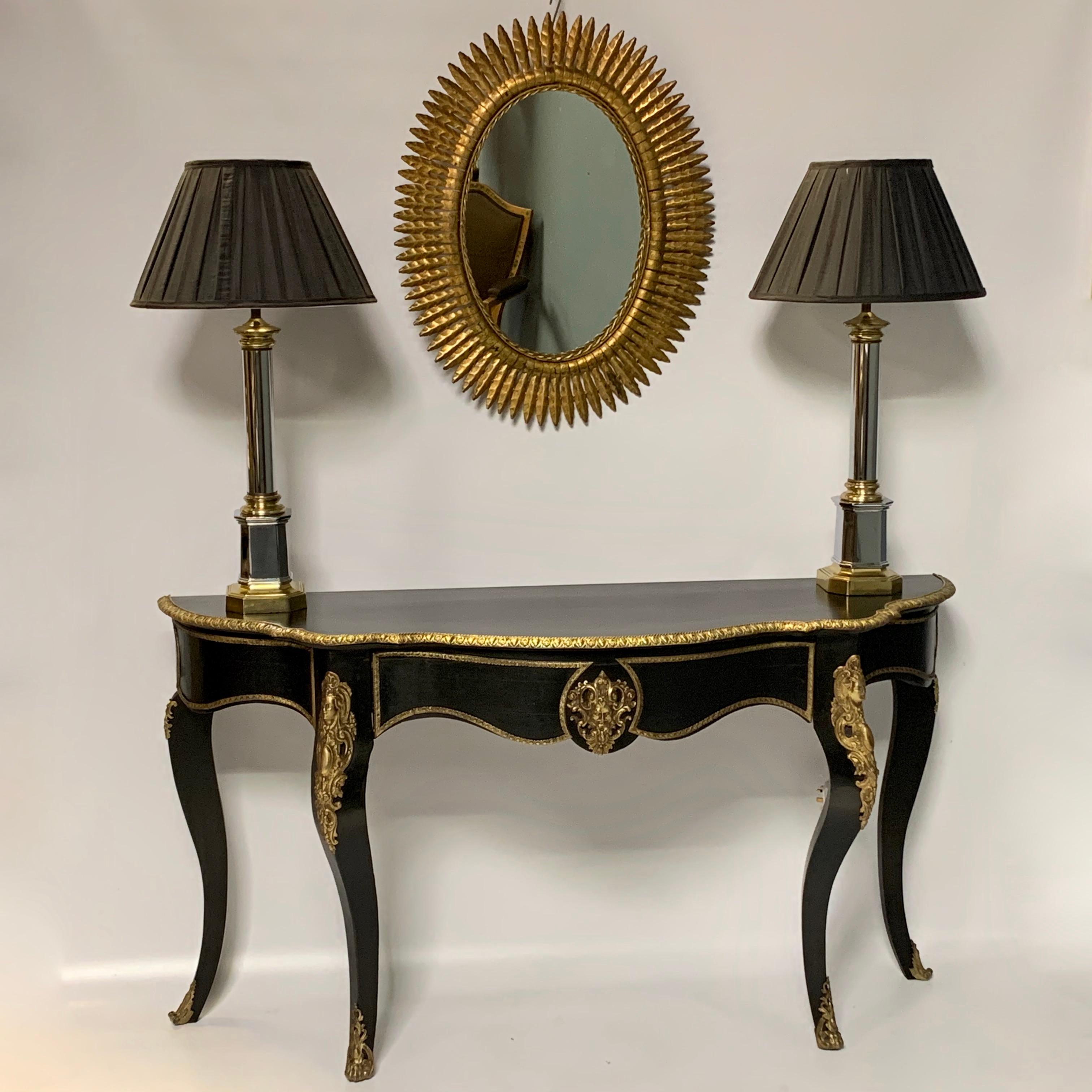 Very decorative Spanish gilt metal oval wall mirror with a really good clean and bright gilt finish.
Lovely size and will hang well over a chest or console table as shown below for proportions.
Not a heavy mirror, so you can hang it easily from a