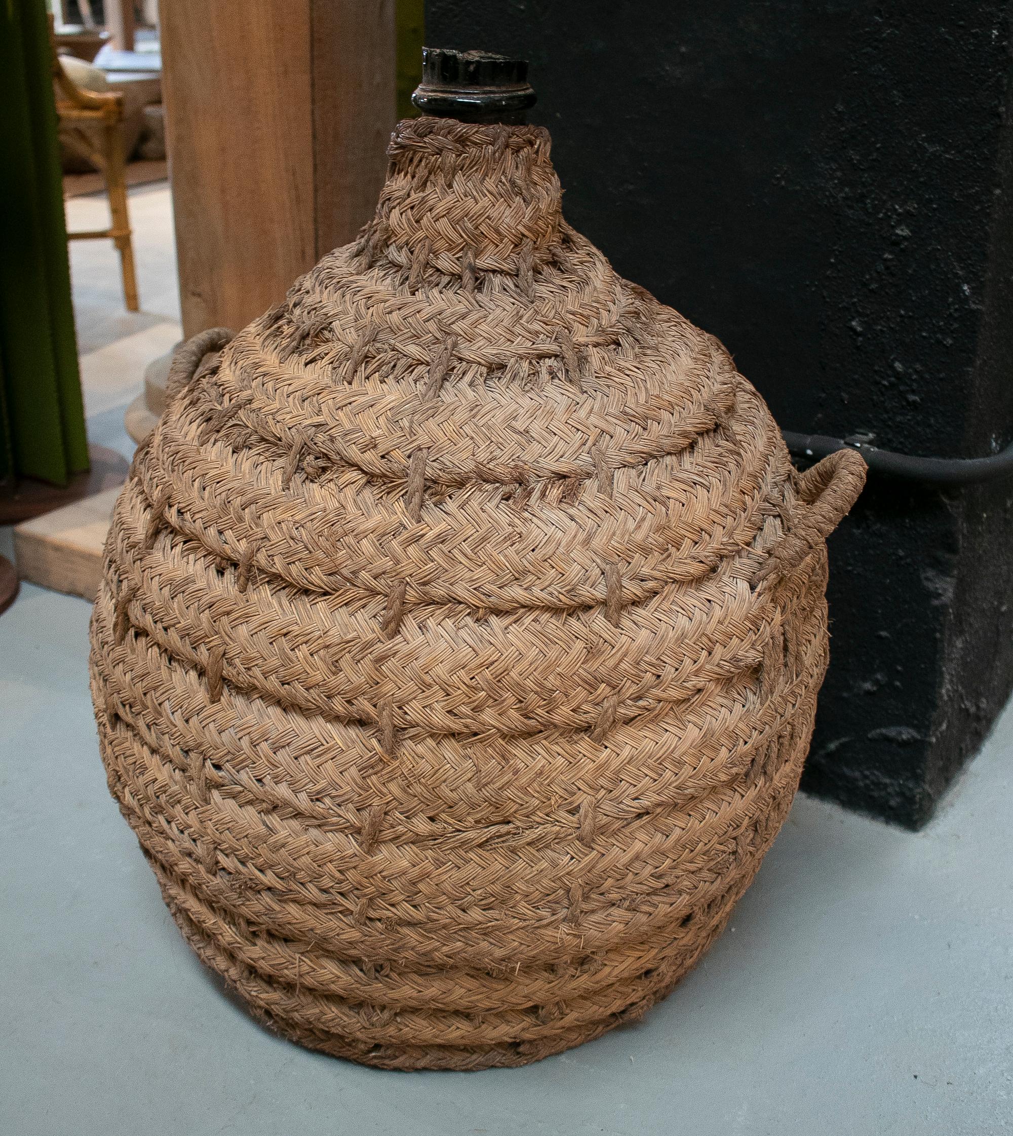 1950s Spanish Glass Demijohn in Hand Woven Esparto Grass Basket In Good Condition In Marbella, ES