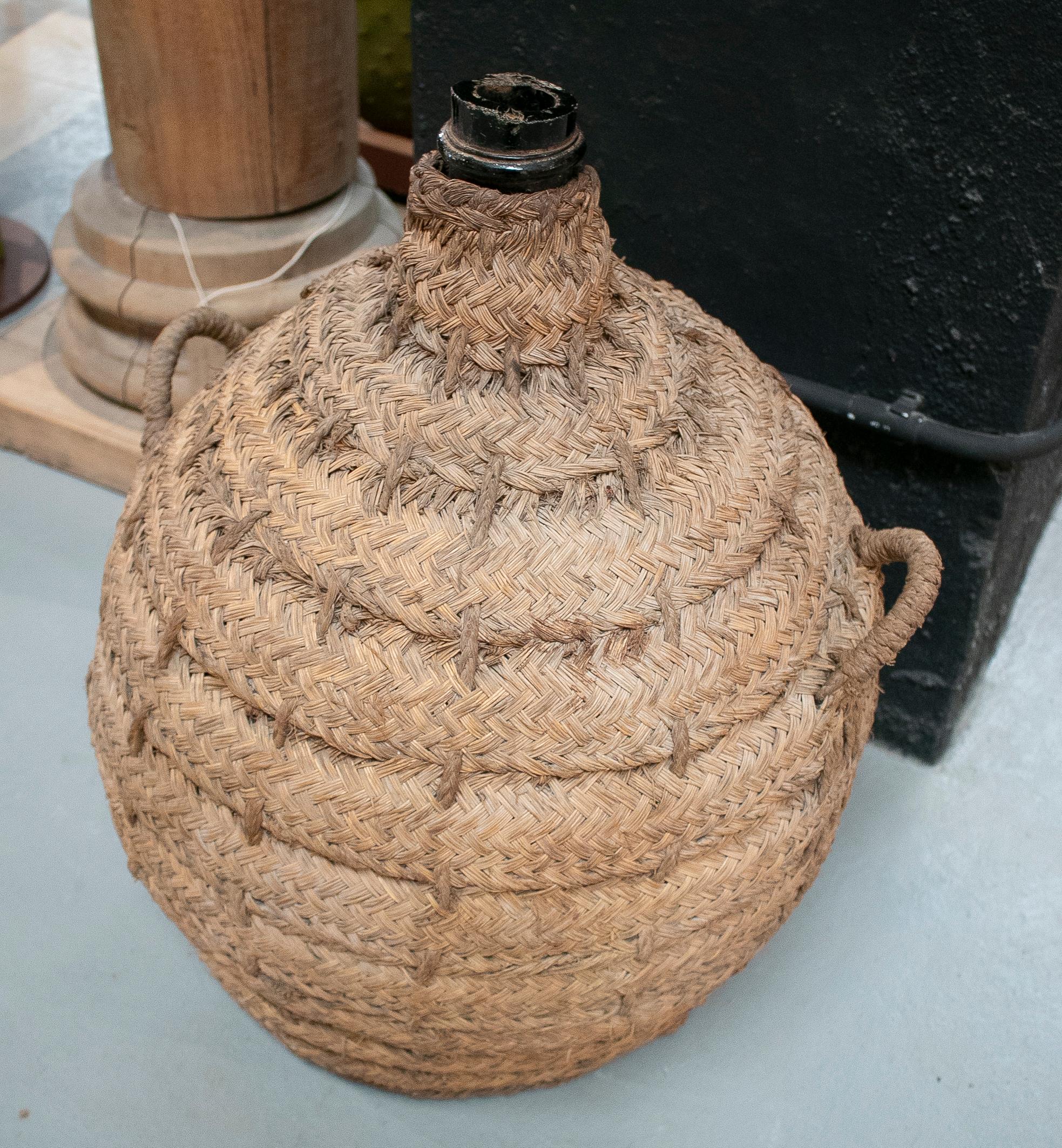 20th Century 1950s Spanish Glass Demijohn in Hand Woven Esparto Grass Basket