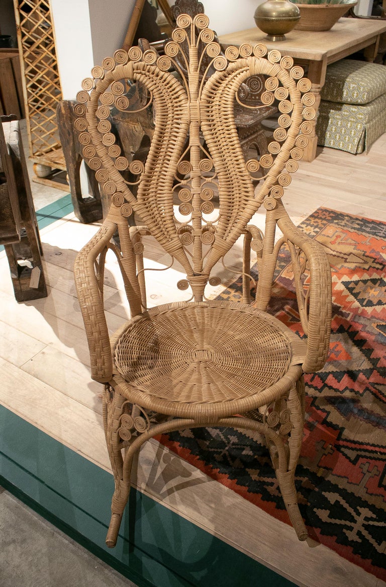1950s Spanish hand woven wicker rocking chair.