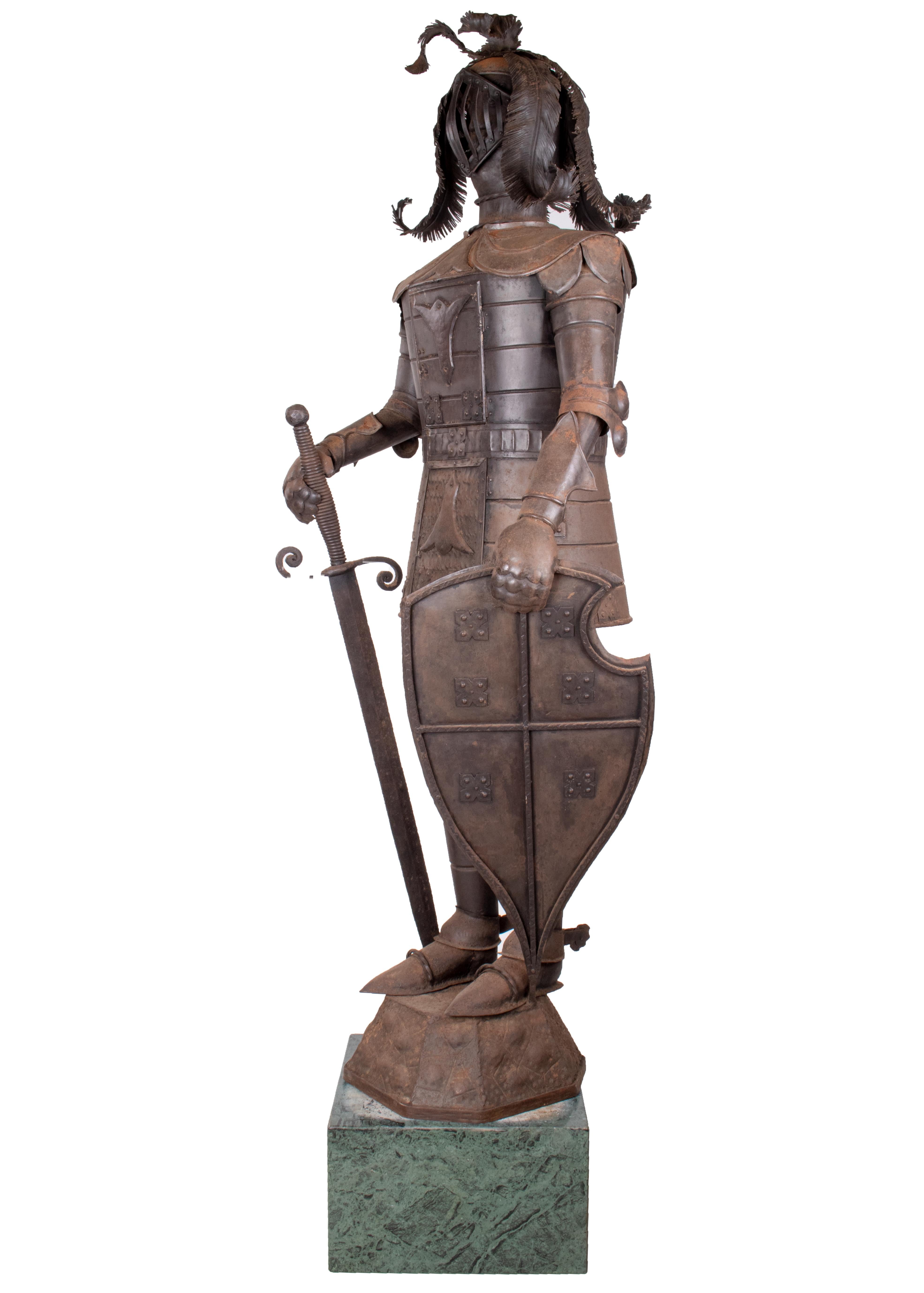 1950s Spanish iron suit of armour on a green serpentine marble pedestal. Two locked compartments on the breast plate accessible from the front.
Suit of armour dimensions: 175 x 60 x 55cm
Marble pedestal dimensions: 25 x 40 x 40cm.
  