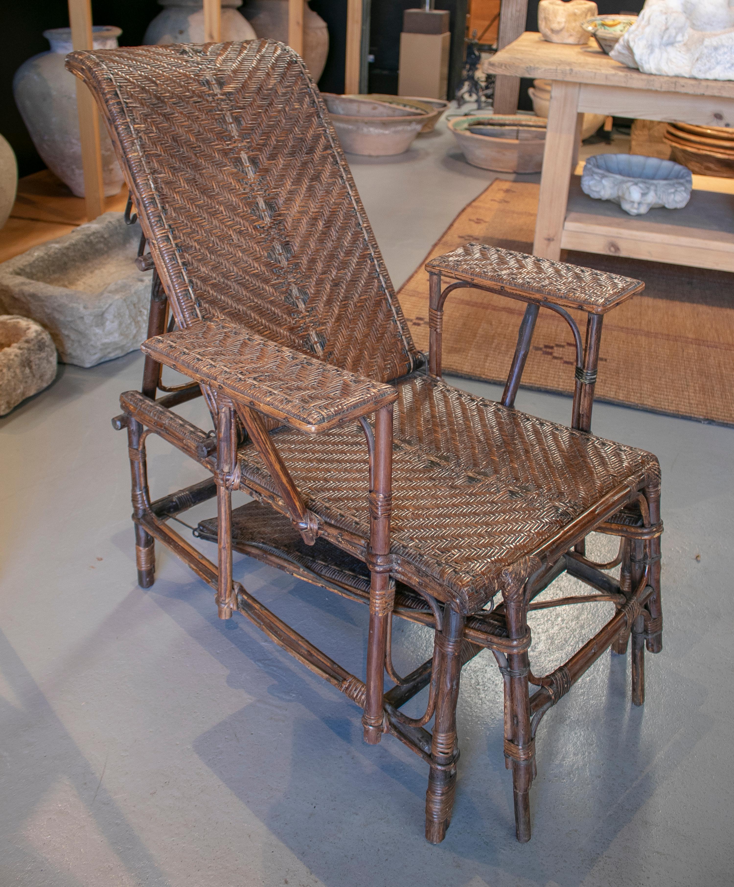 1950s Spanish outdoor wicker and bamboo arm chaise-longue.

 