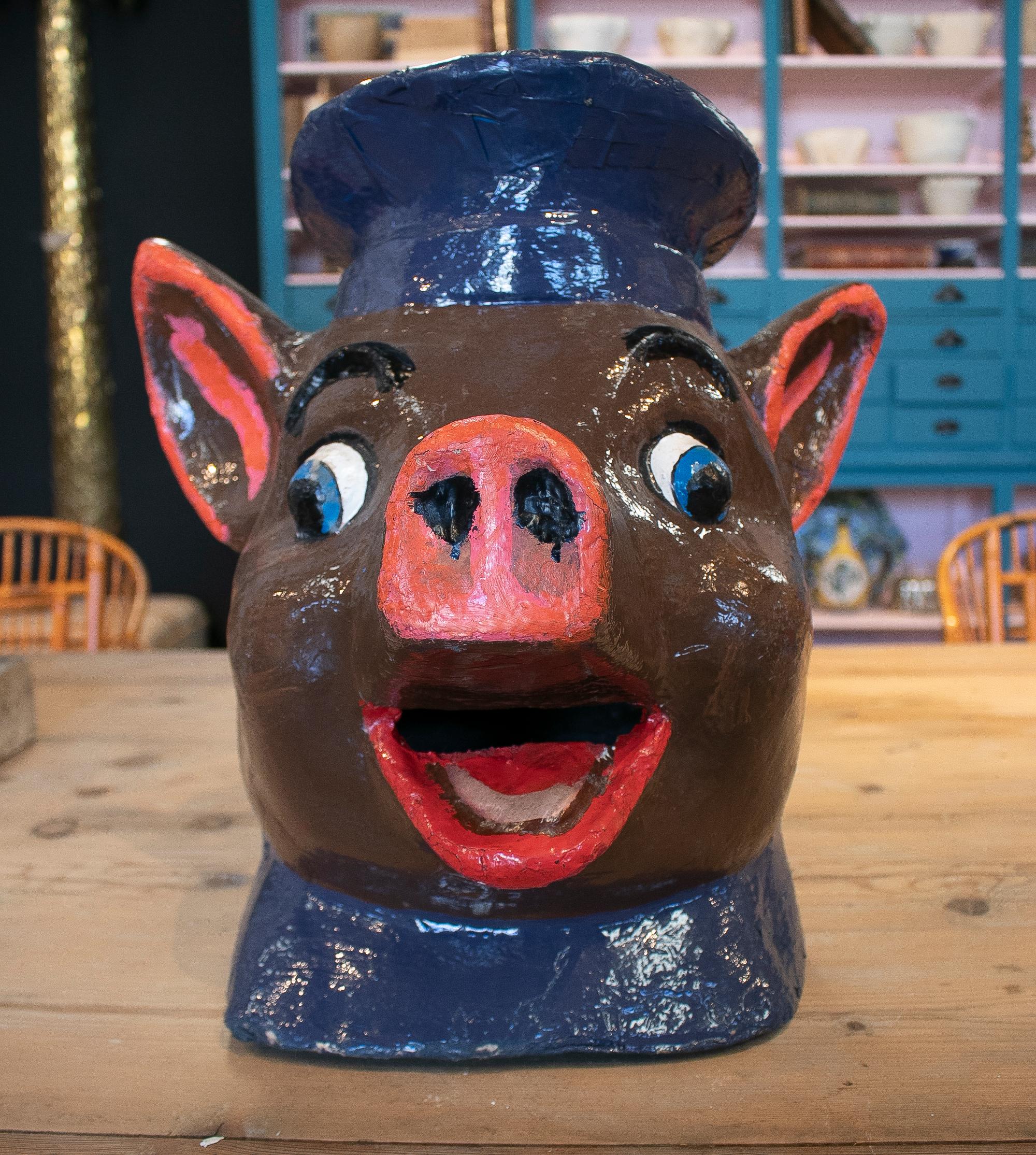 Popular 1950s Spanish pig head hand painted papier-mâché mask worn during village festivals.
 