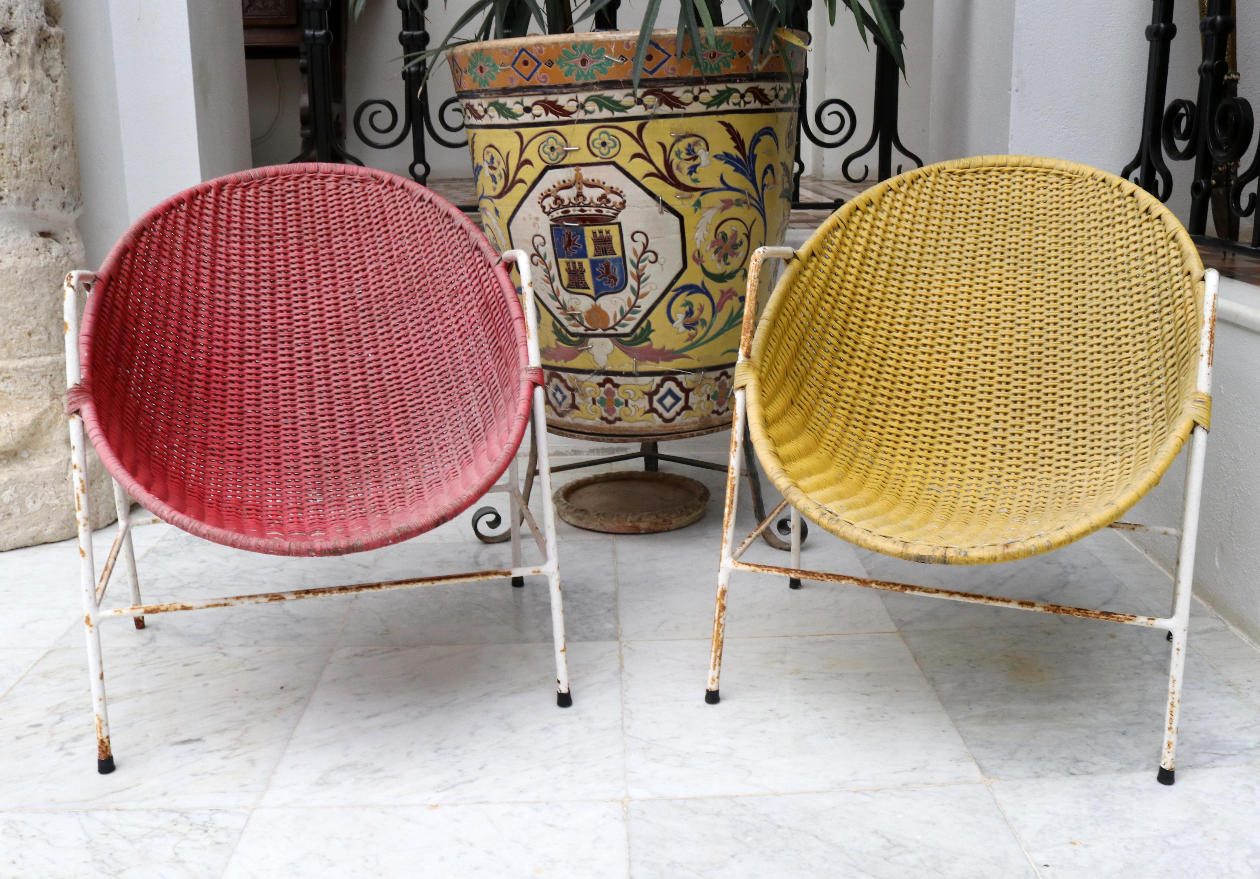 1950s Spanish red and yellow handwoven willow wicker armchairs with iron frame.