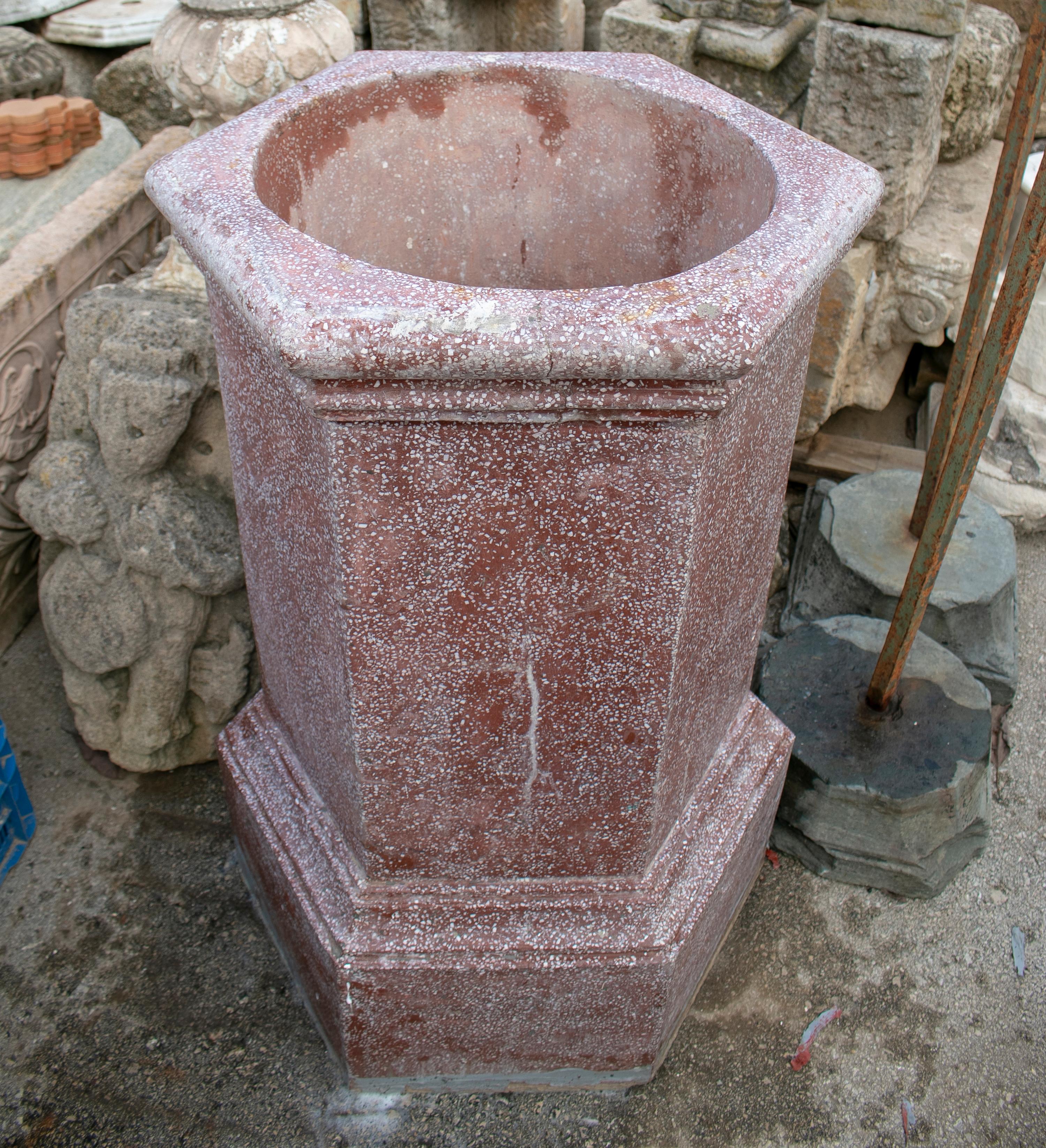 1950s Spanish red reconstituted stone wellhead.