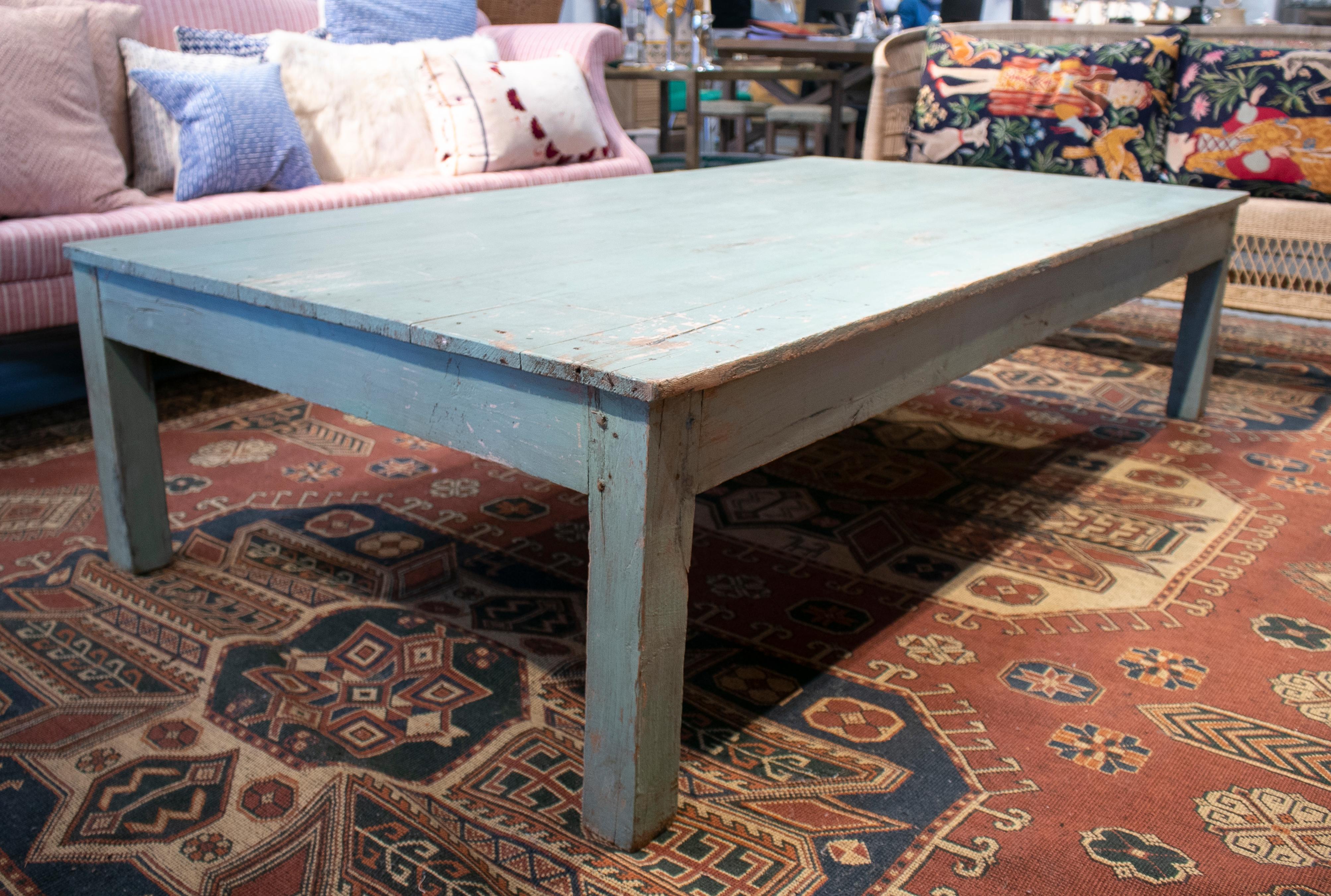 Rustic 1950s Spanish wooden coffee table painted turquoise blue.