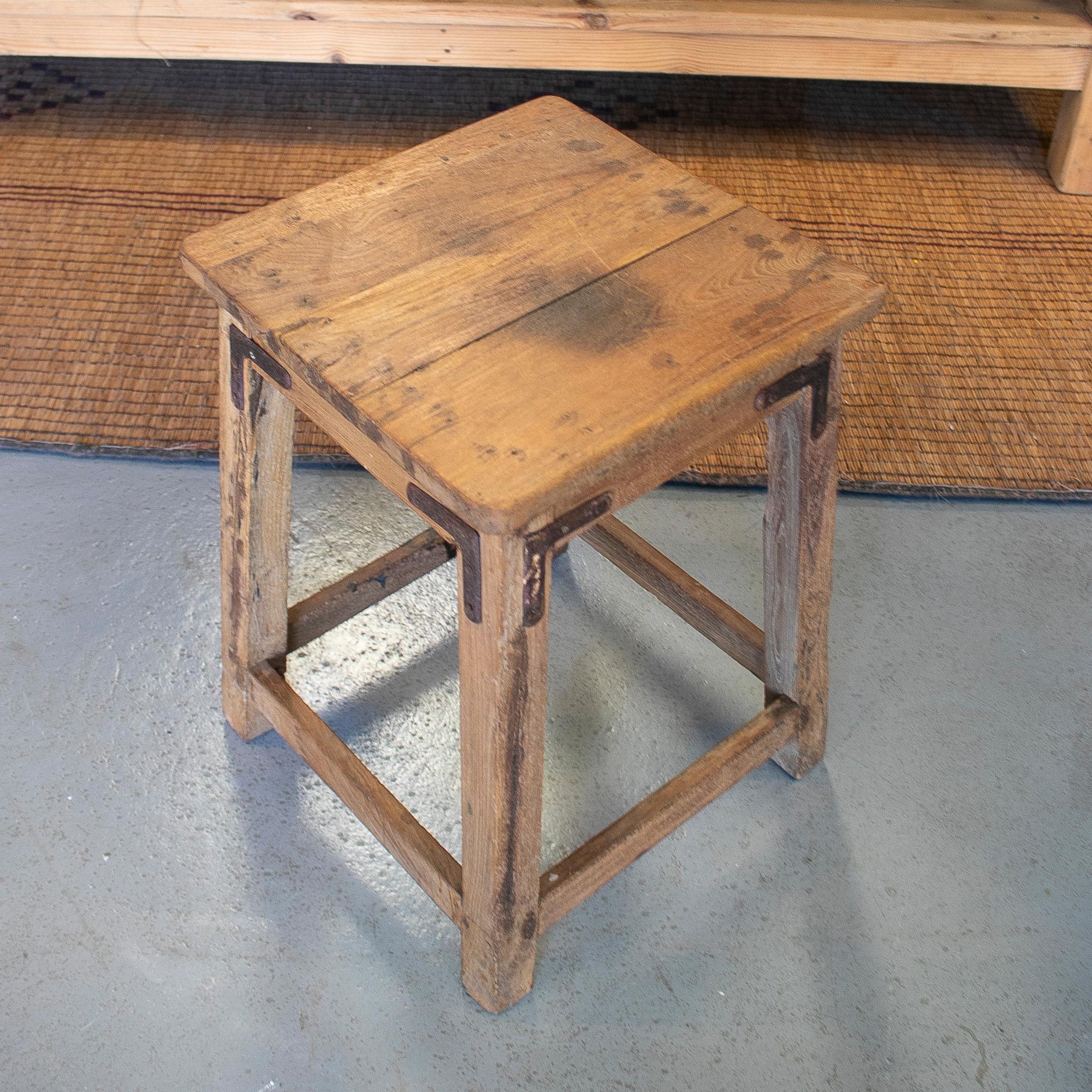 Vintage 19502 Spanish wooden low stool with iron corner braces.