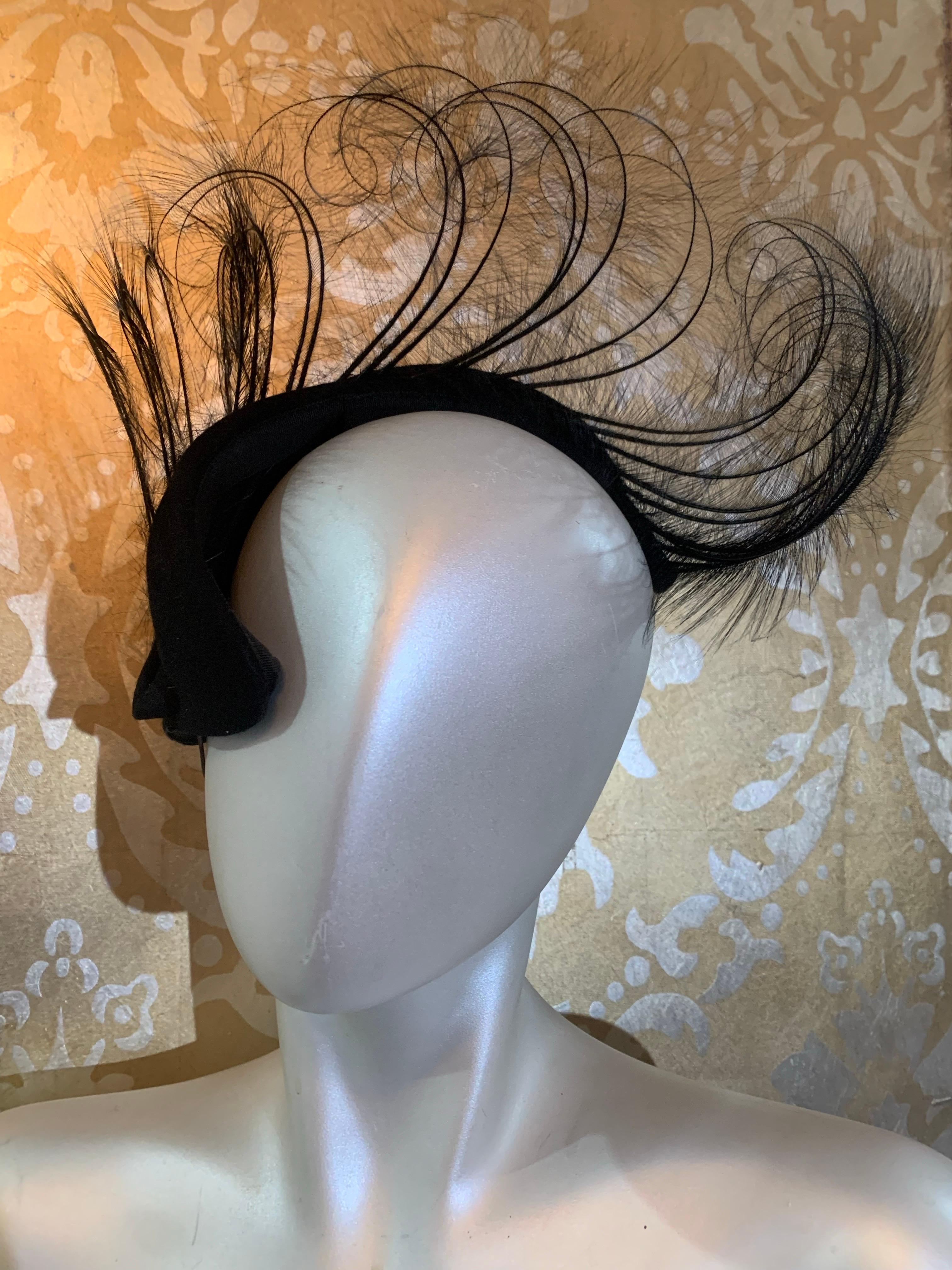 1950s Spectacular Black Felt Capulet Hat w Dramatic Curled Egret Feather Spray:  This fantastic statement hat is in basic black felt with a close-fitting cap with a center back point and a huge, upright row of identically curved black egret