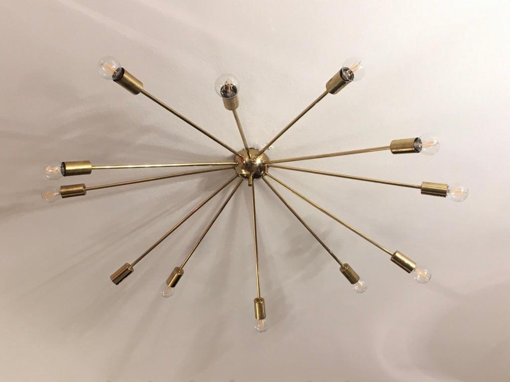 Decorative 12 arms Sputnik brass ceiling lamp circa 1950s
Probably Italian
Very good condition.