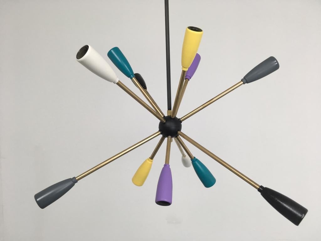 1950s Sputnik lamp in different colors. 

12 x E14 bulbs.

To be on the the safe side, the lamp should be checked locally by a specialist concerning local requirements.