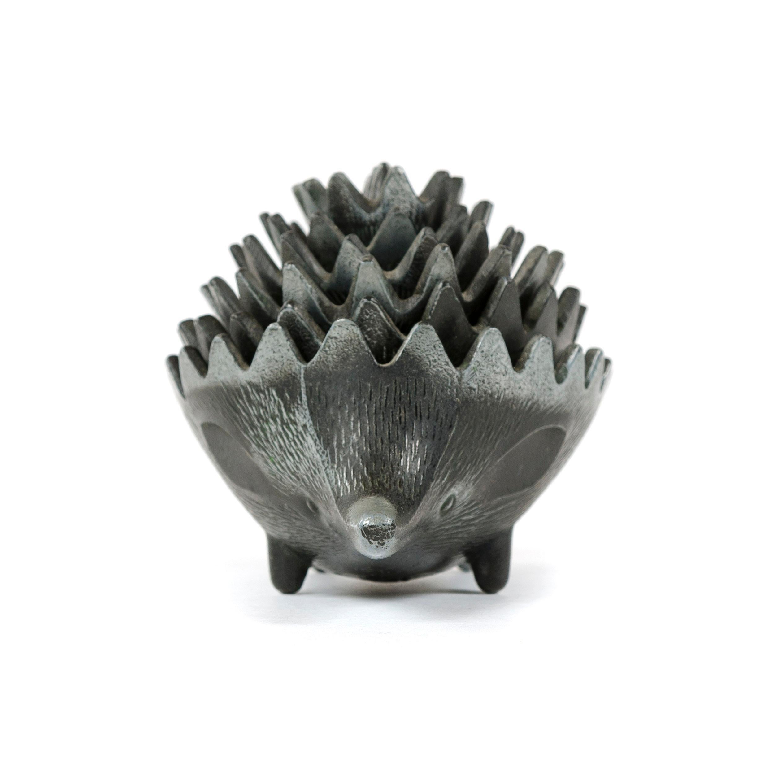 A set of (6) pewter stacking ashtrays in the form of a hedgehog, in the style of Walter Bosse.