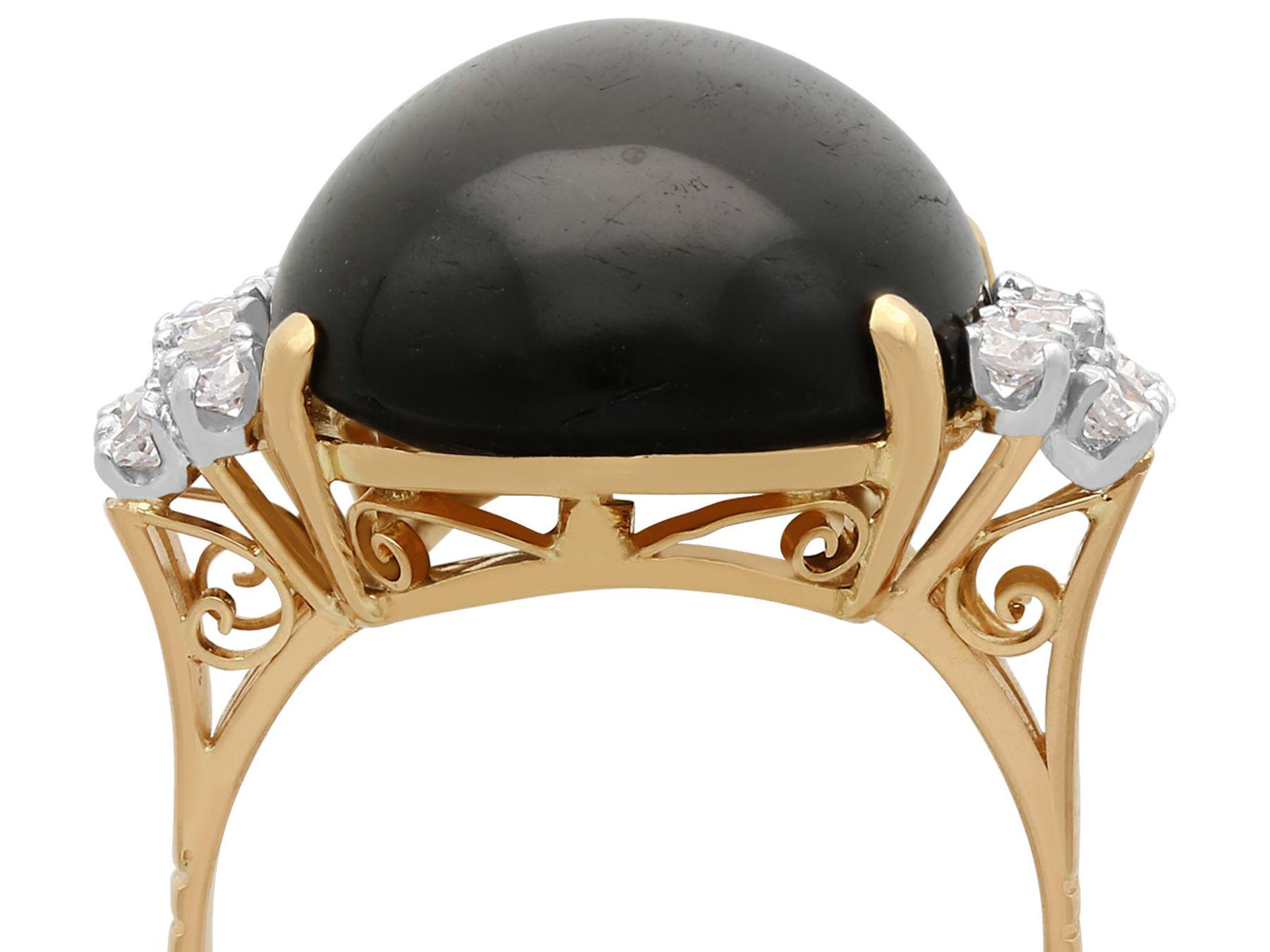 A stunning, fine and impressive vintage cabochon star onyx and 0.65 carat diamond, 18 karat yellow gold dress ring; part of our diverse antique jewelry and estate jewelry collections.

This stunning, fine and impressive vintage cabochon cut cocktail