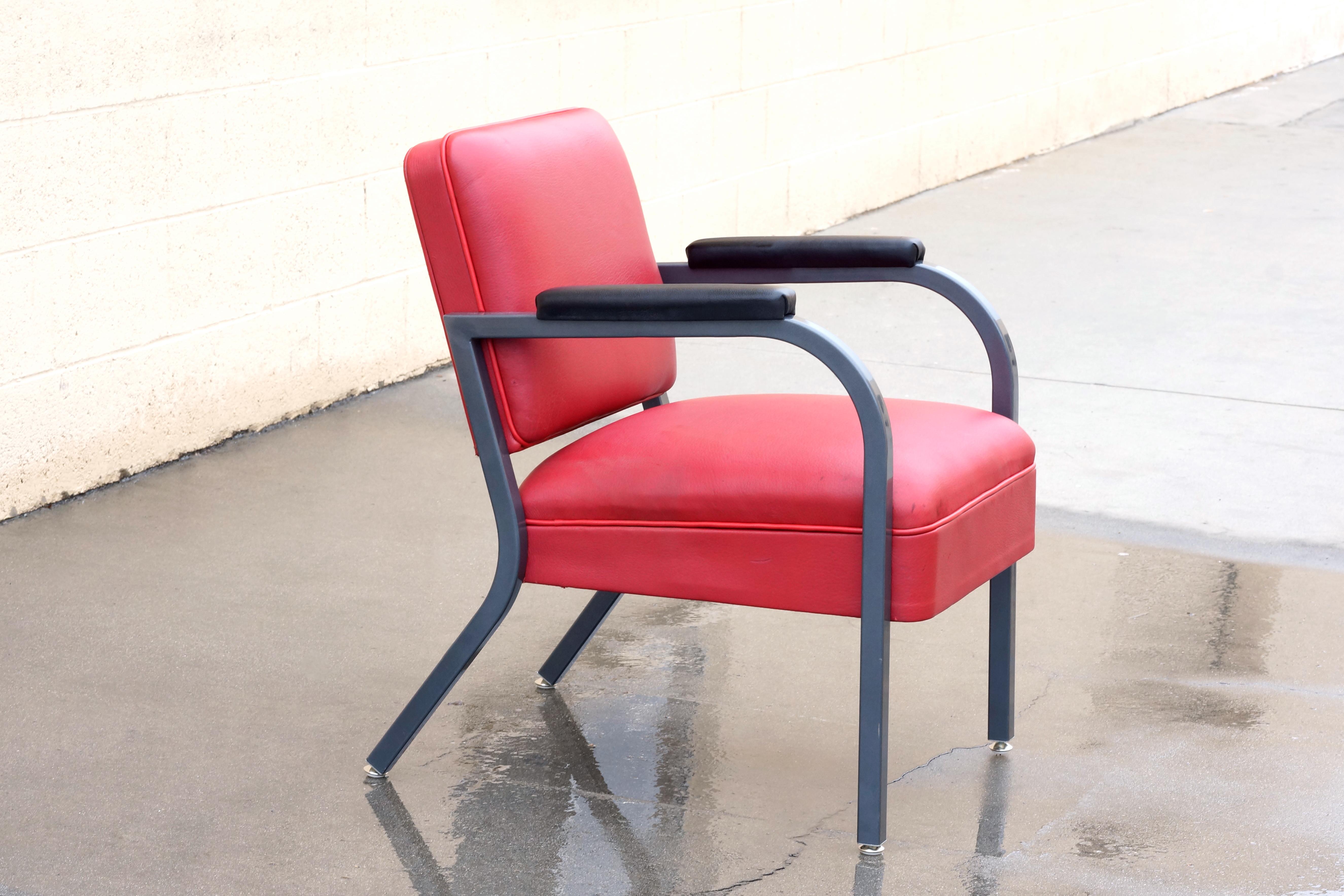 Wonderfully articulated armchair from the early 1950s. Uncommon frame design with atomic styling. Newly refinished steel in Metallic Gray (GR02), red deerskin seat and black leather armcaps. 

Dimensions: 21