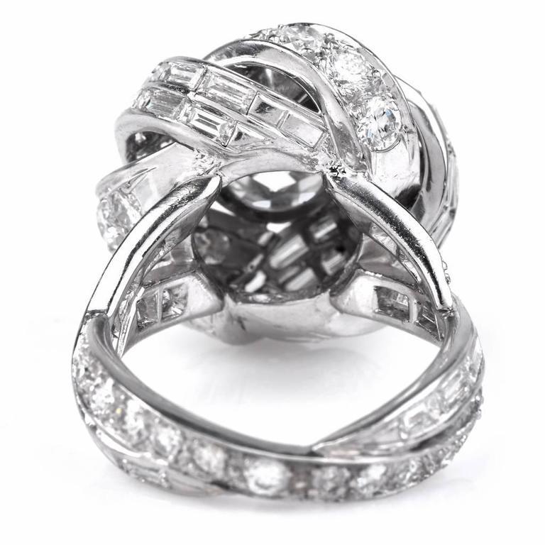 This upscale diamond Diamond ring by STERLE is hand crafted in solid platinum, centered with a genuine natural round European cut diamond of approx.3.15 , graded G-H color and VS2-VS1 clarity, prong set in a floral inspired mounting. It is