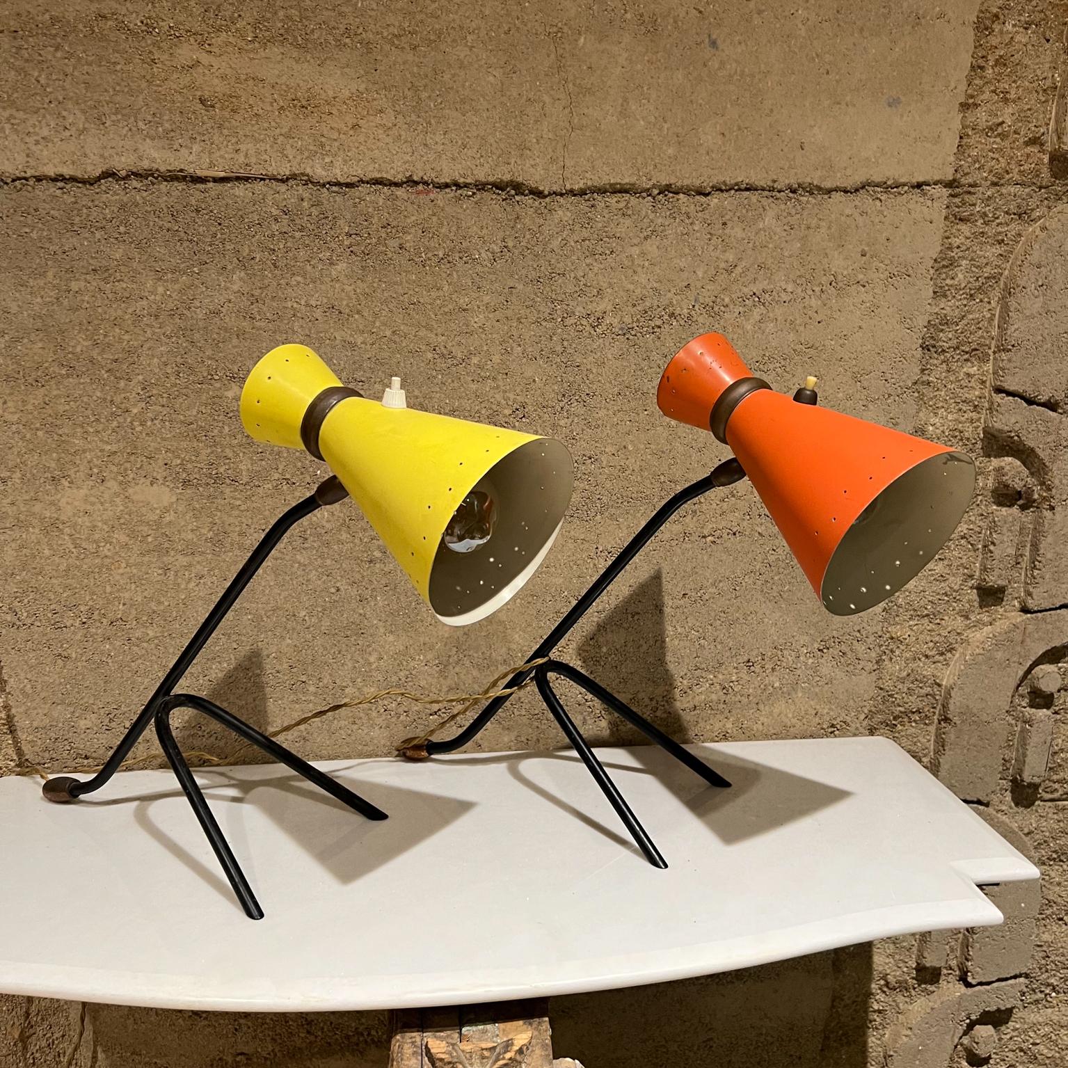 1950s Italy Desk Table Lamps with Perforated Cone shade red and yellow
Attribution Stilnovo.
Vibrant colored aluminum on a sculptural black iron base with brass accent.
Unmarked
14.5 tall x 18 d x 6.25 w inches
Original Preowned Vintage