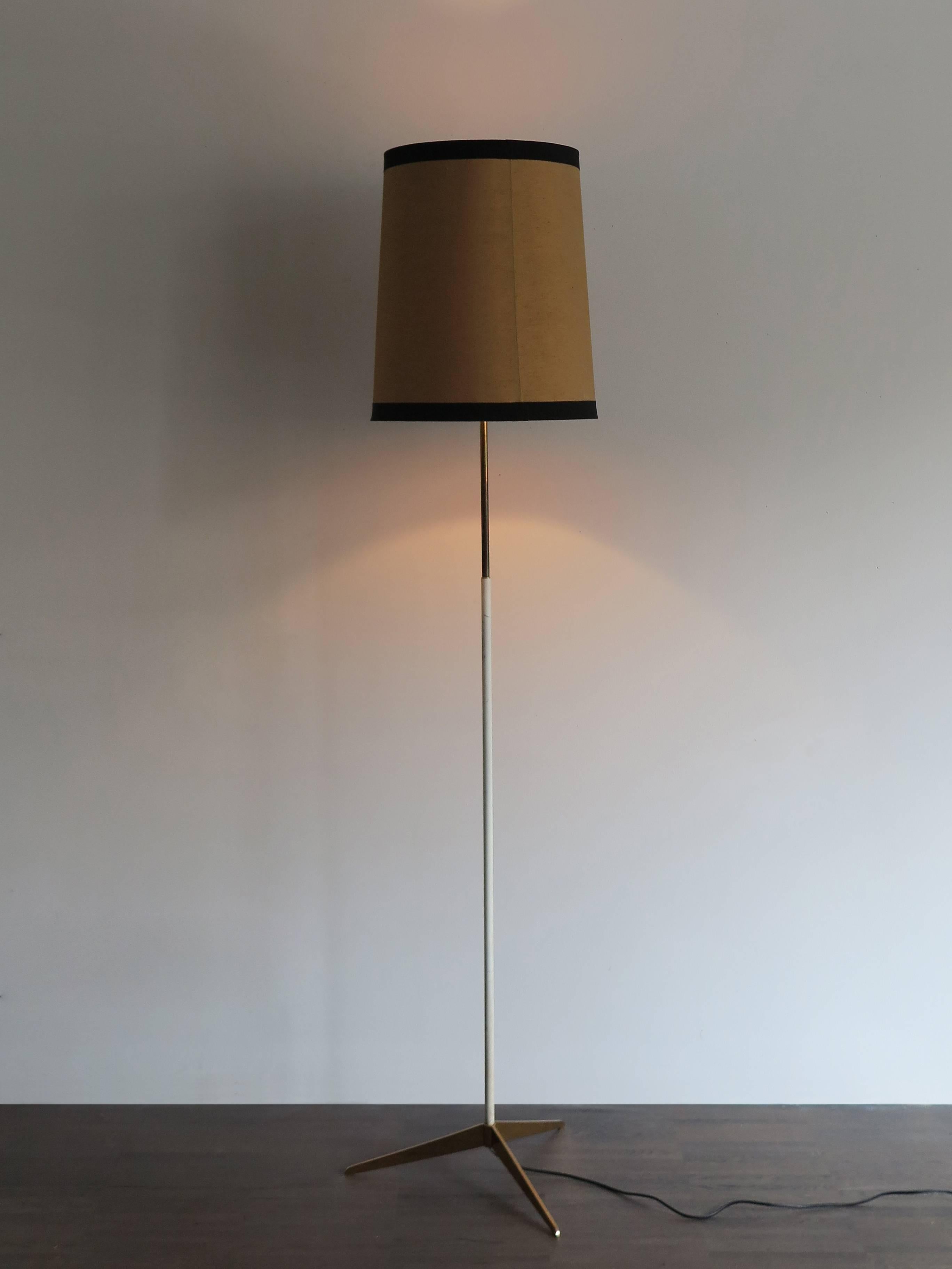 Italian Stilnovo Mid-Century Modern floor lamp with brass base, original fabric shade
and manufacturing label, circa 1950s.